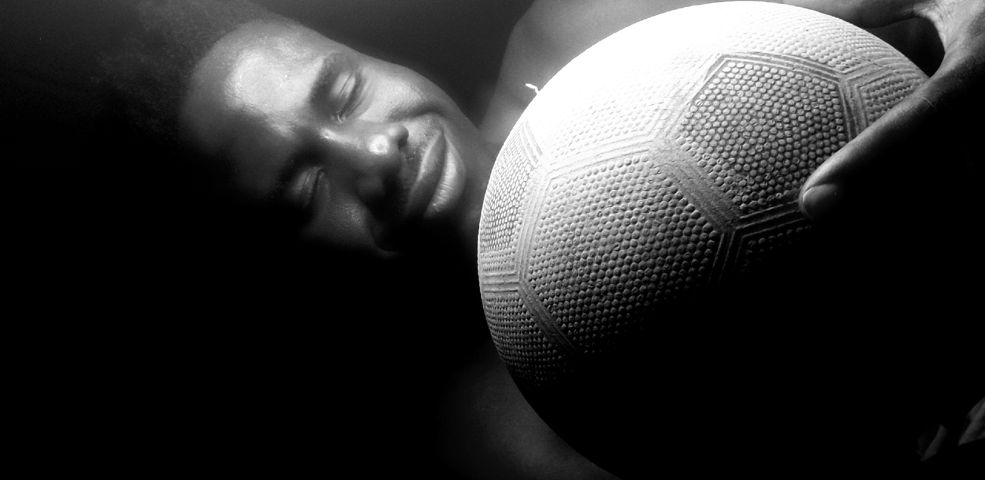 Man photographed with soccer ball in nighttime Narayi session