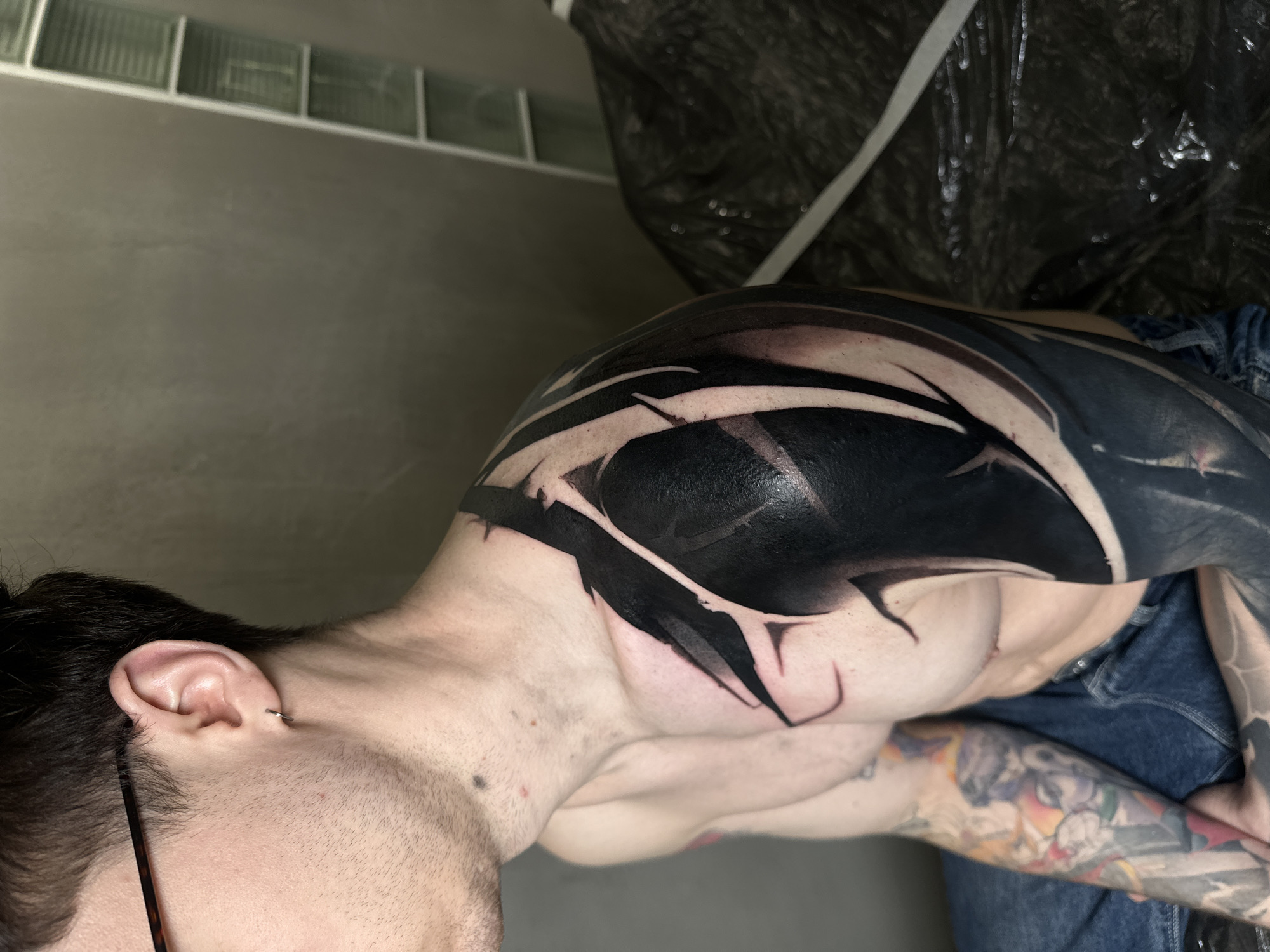 Man documents extensive tattoo artwork in Moscow bathroom selfies