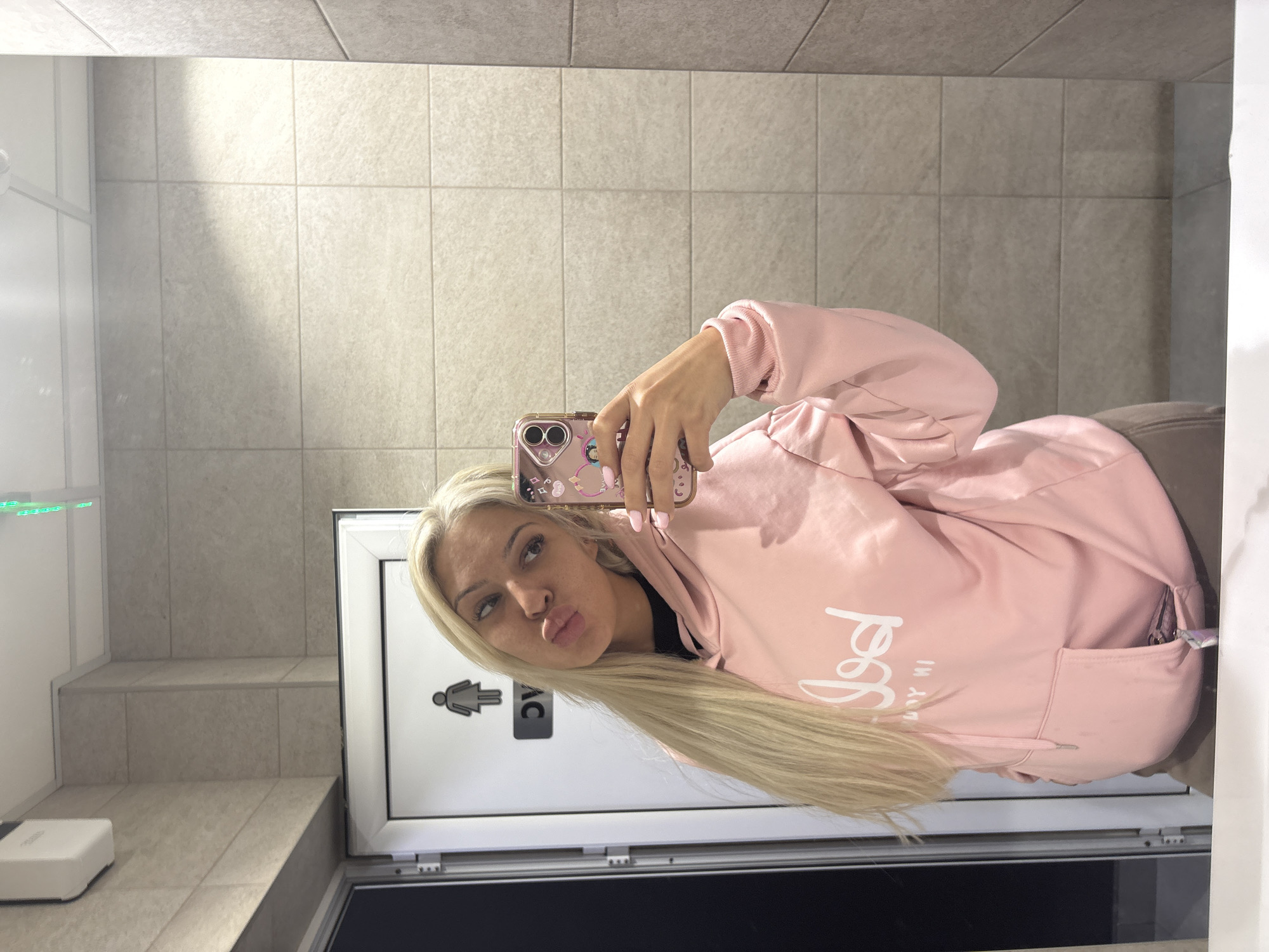 Woman takes bathroom selfies in Lozen, Bulgaria
