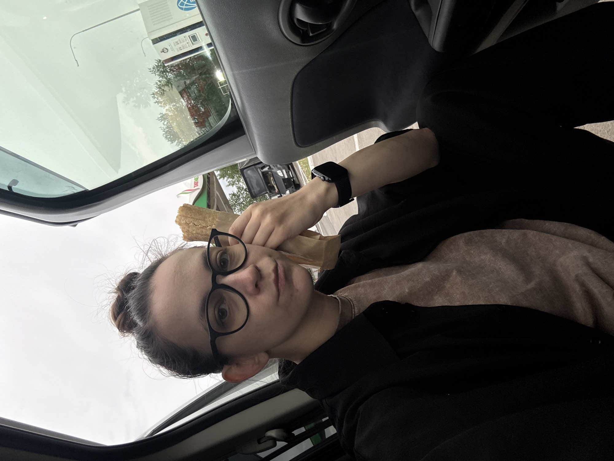 Person enjoys roadside meal at Russian gas station