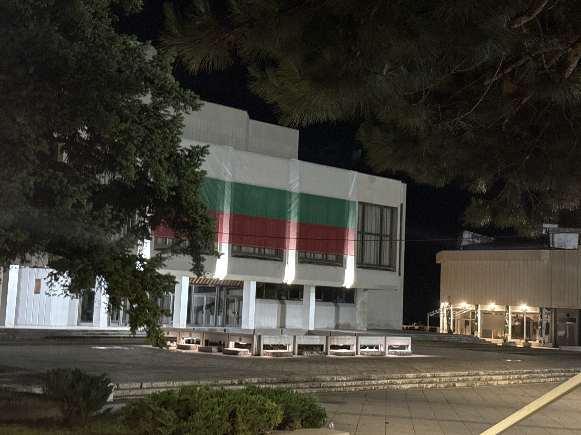 Nighttime documentation captures buildings, portrait, moon, and monument