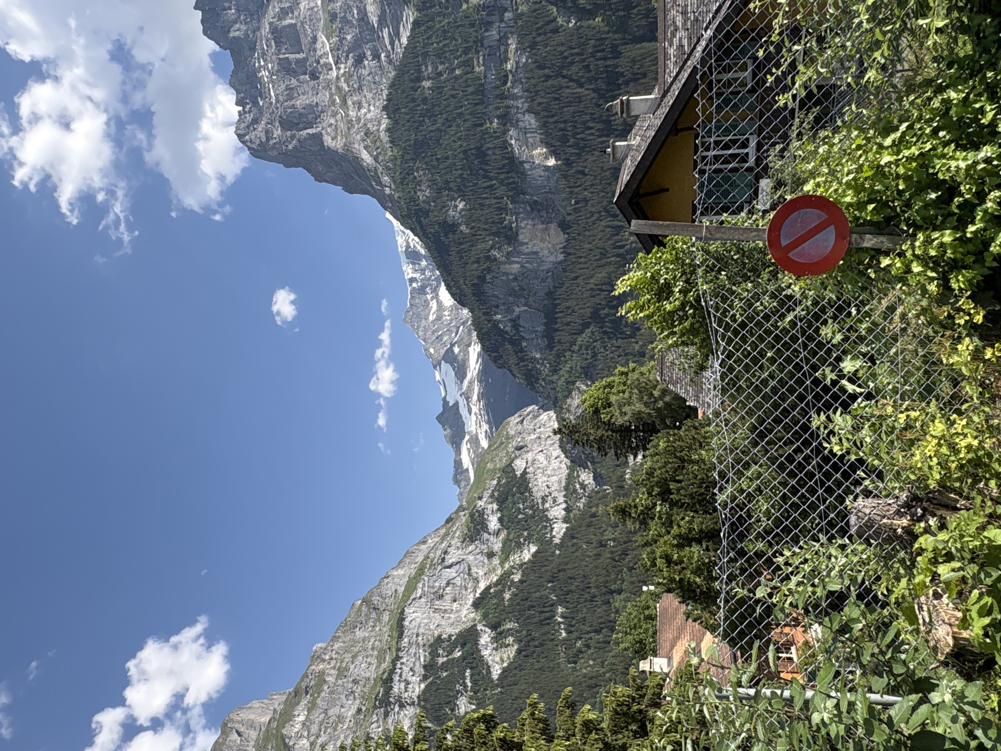 Grindelwald village streets and alpine peaks on a summer afternoon