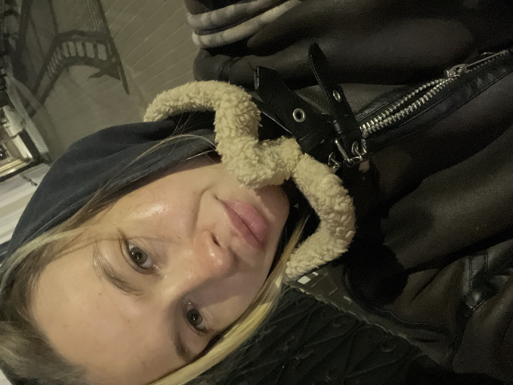 Woman takes nighttime selfies on illuminated Voronezh street