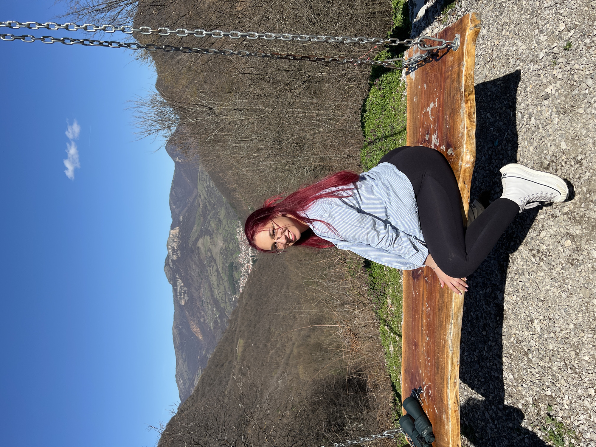 Woman relaxes on swing bench in Teteven, Bulgaria