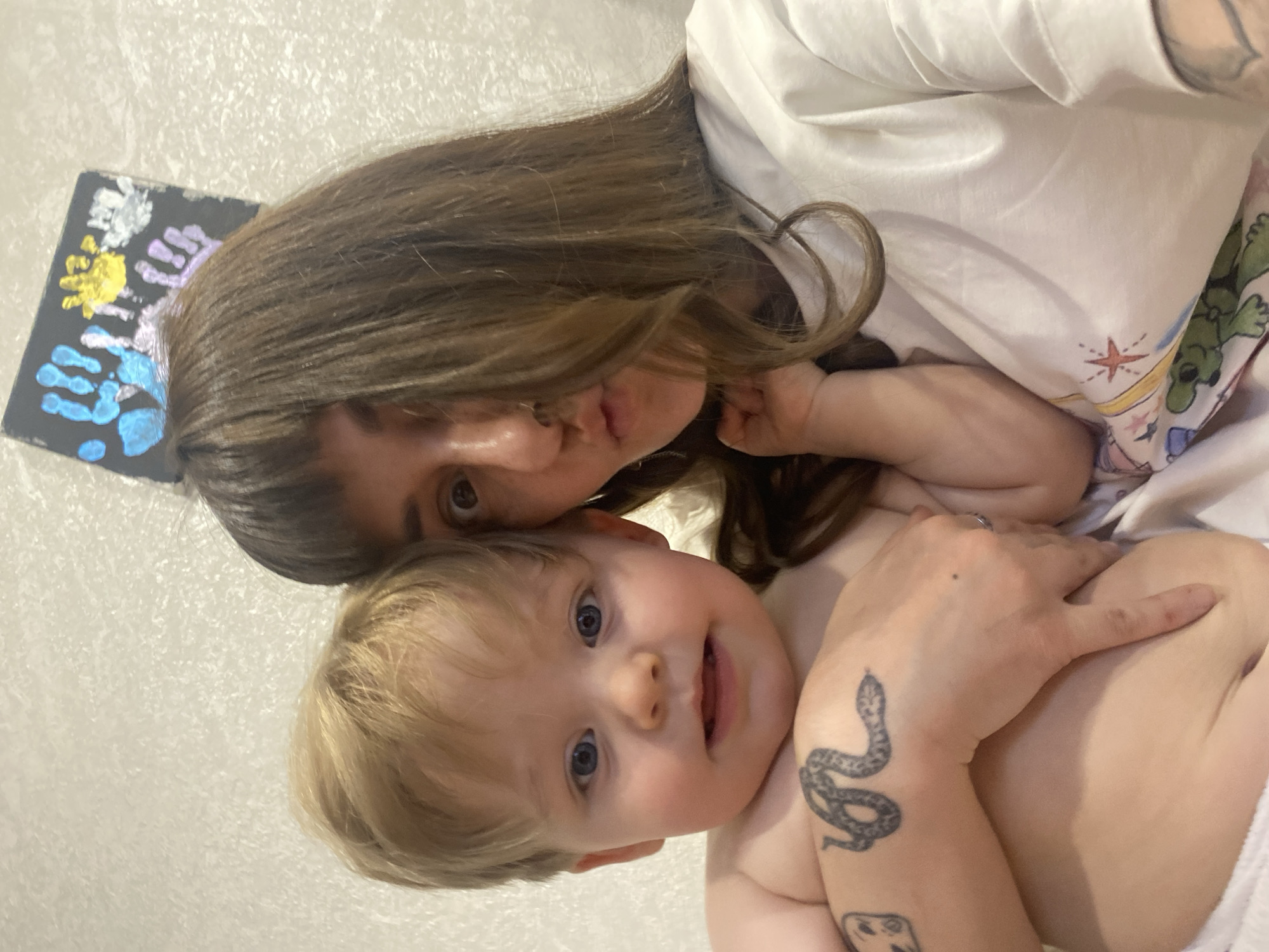 Adult holds toddler in Votkinsk, Russia