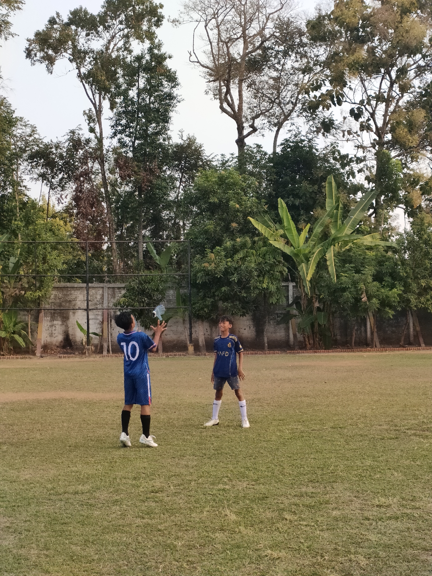 Youth soccer practice underway at a Banguntapan community field