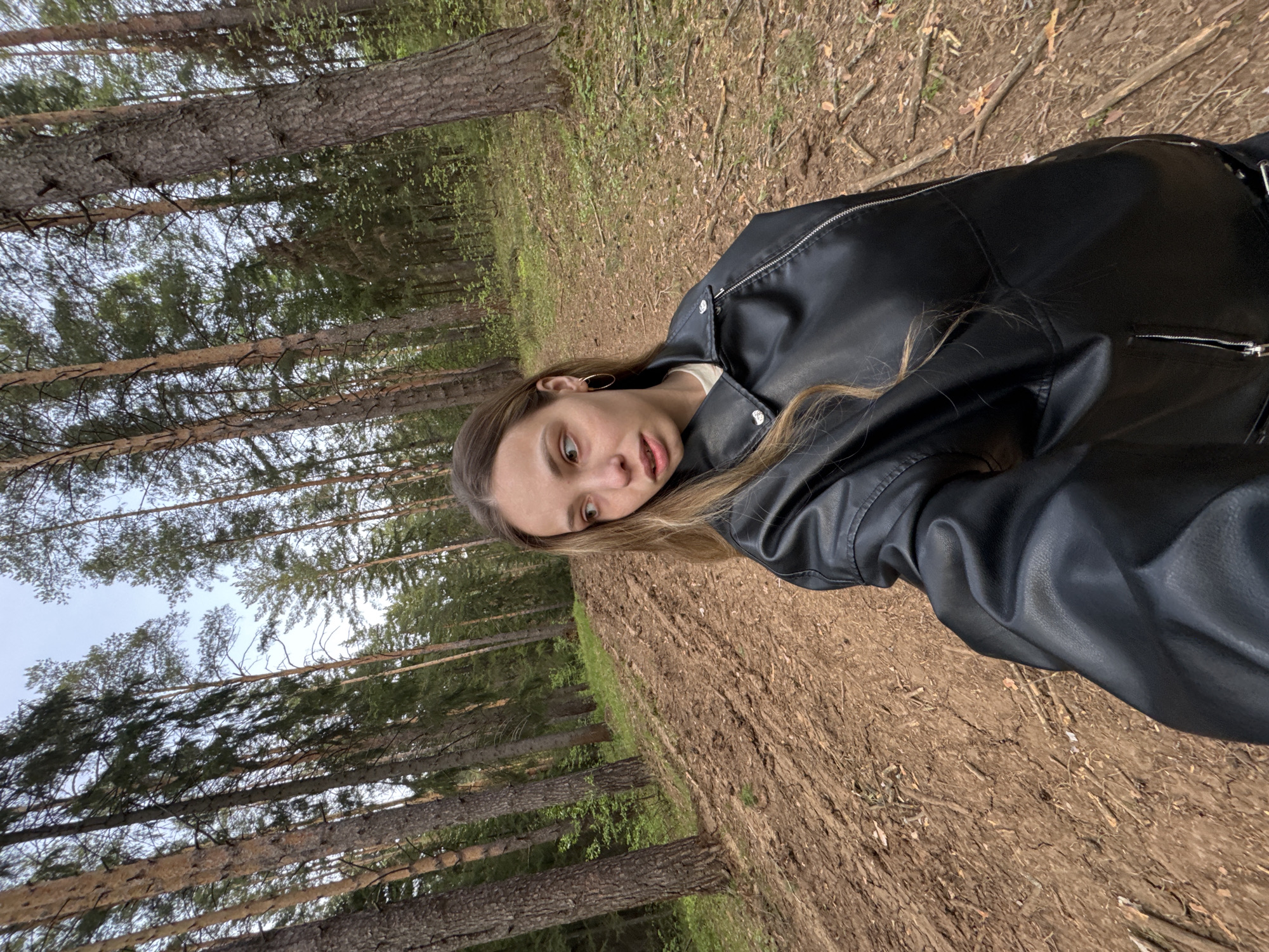 Woman poses for casual photos in Russian forest