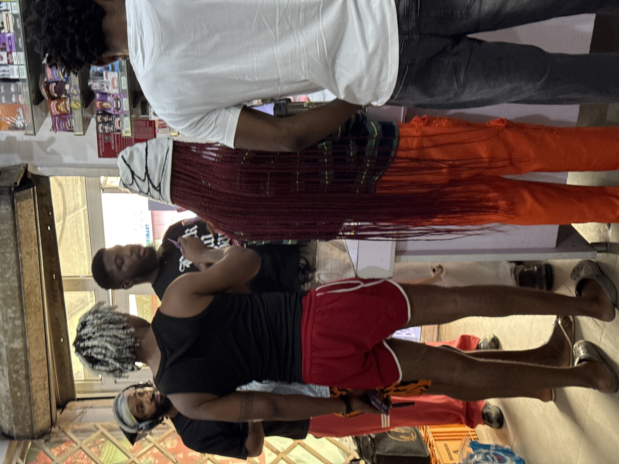 Daily commerce unfolds on Ado street vendors and shops