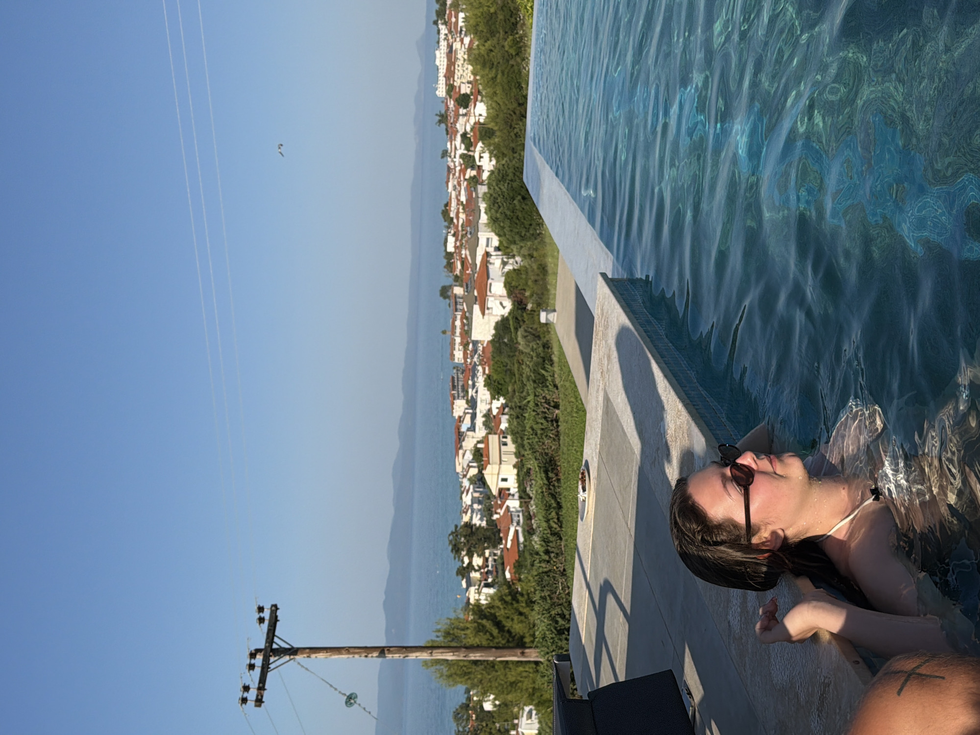 Sunny afternoon at a Greek outdoor pool, summer 2026