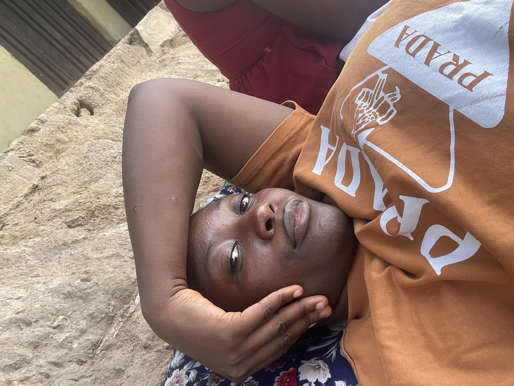 Casual family gathering on mats in Akwanga, Nigeria