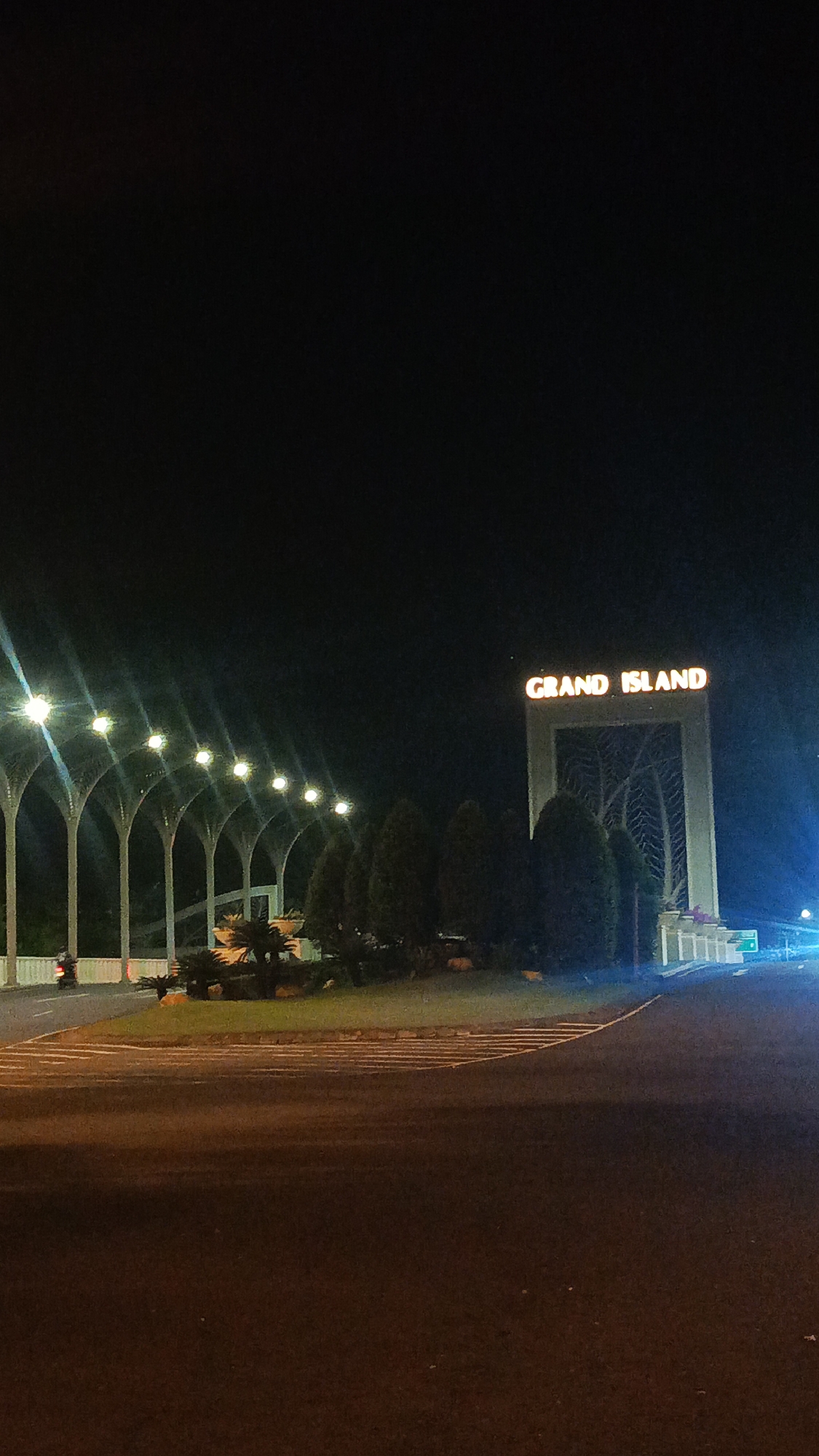 Grand Island entrance captured at night in Surabaya