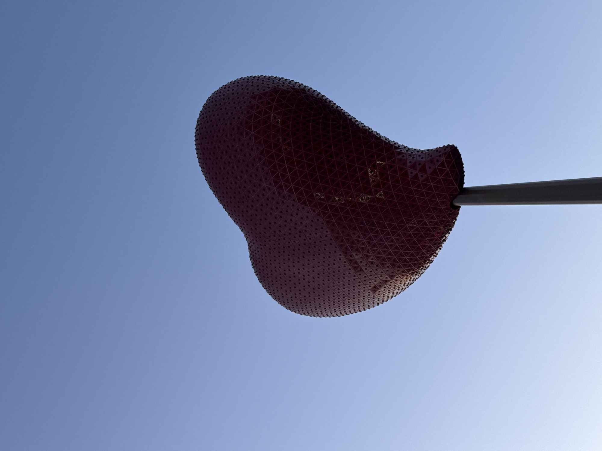 Red heart sculpture spotted on pole in Paris