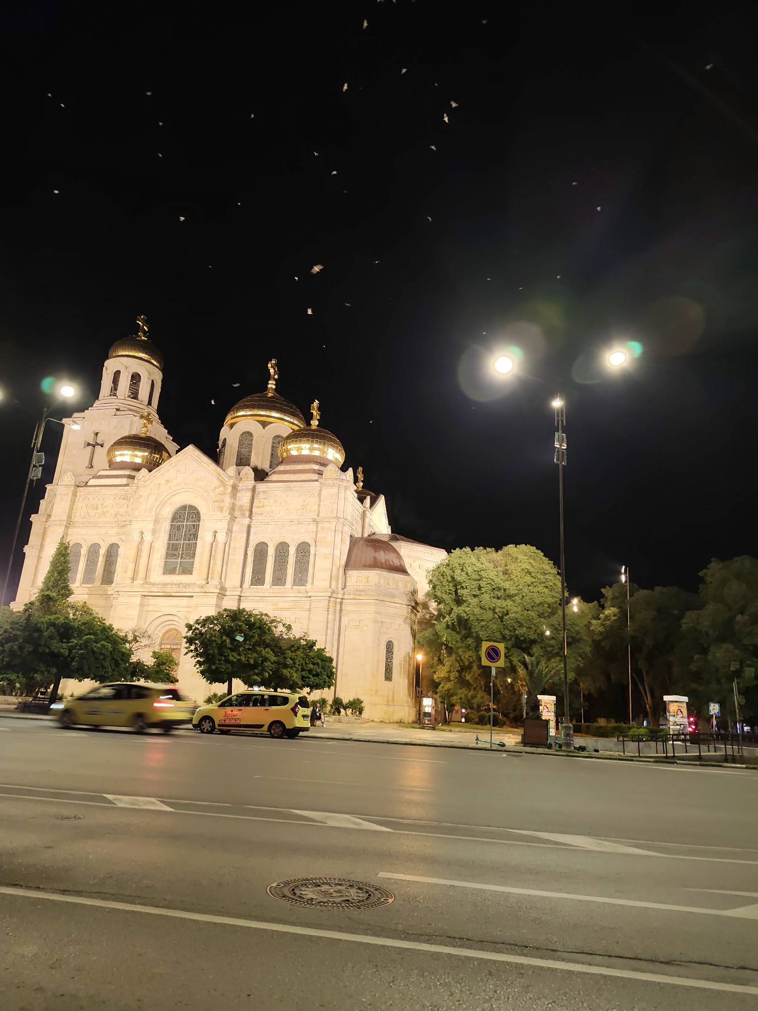 Varna's landmark cathedral glowing at night, golden domes and all