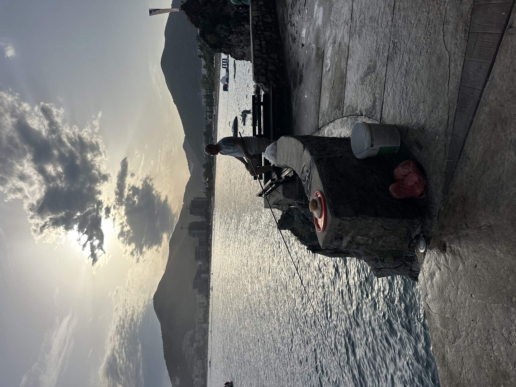 Lazy afternoon on the Budva waterfront, boats and cats included