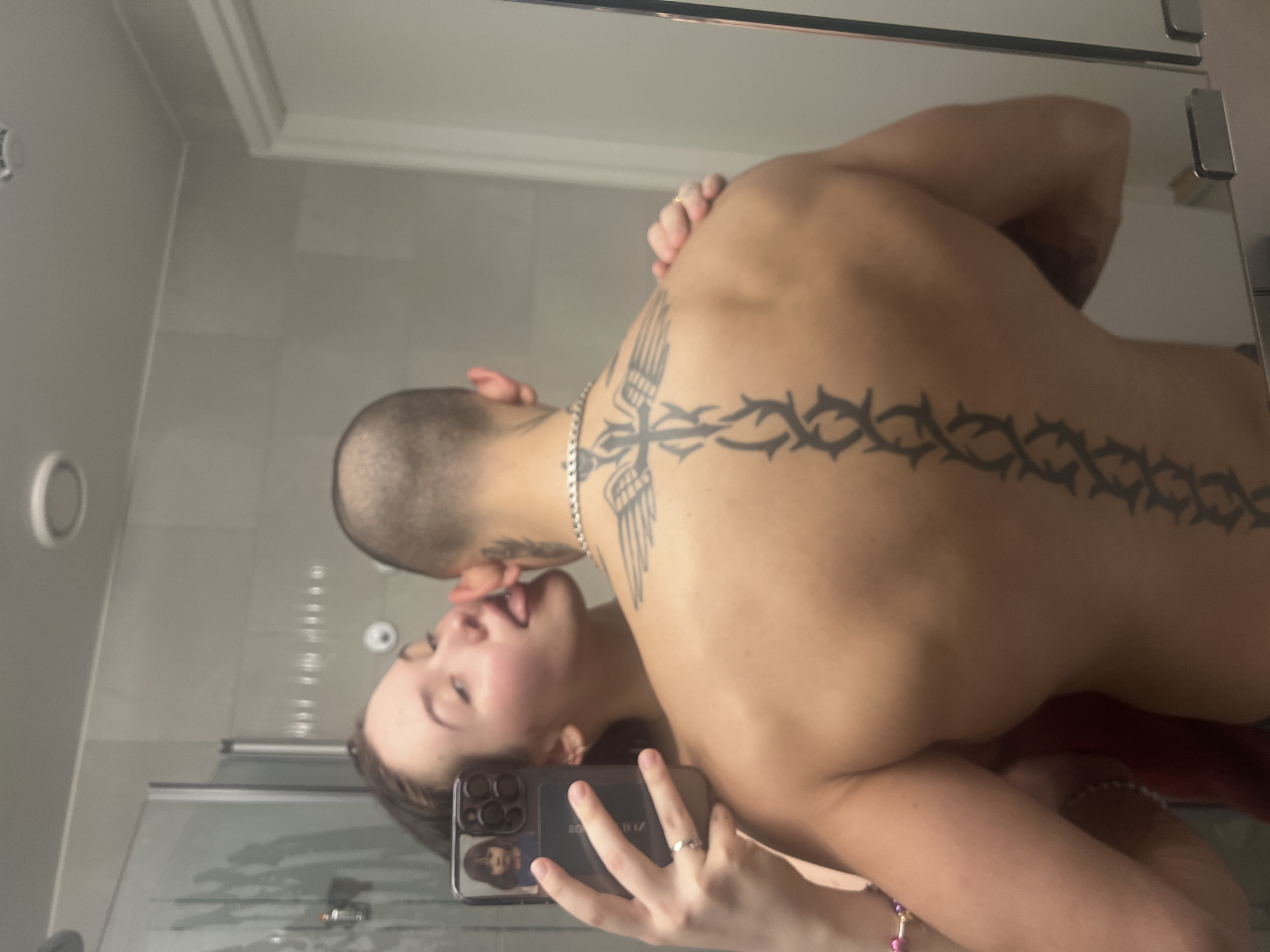 Couple Takes Multiple Mirror Selfies in Vantaa Bathroom