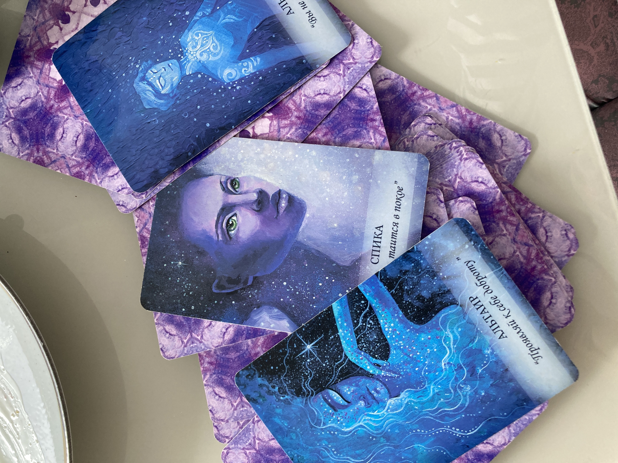 Tarot reading session captured in Florianópolis features cosmic-themed cards