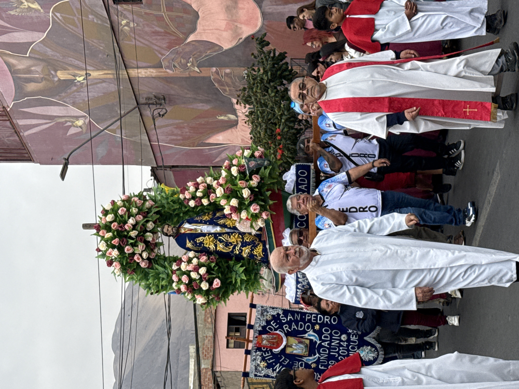 San Pedro procession winds through Iquique with decorated religious floats