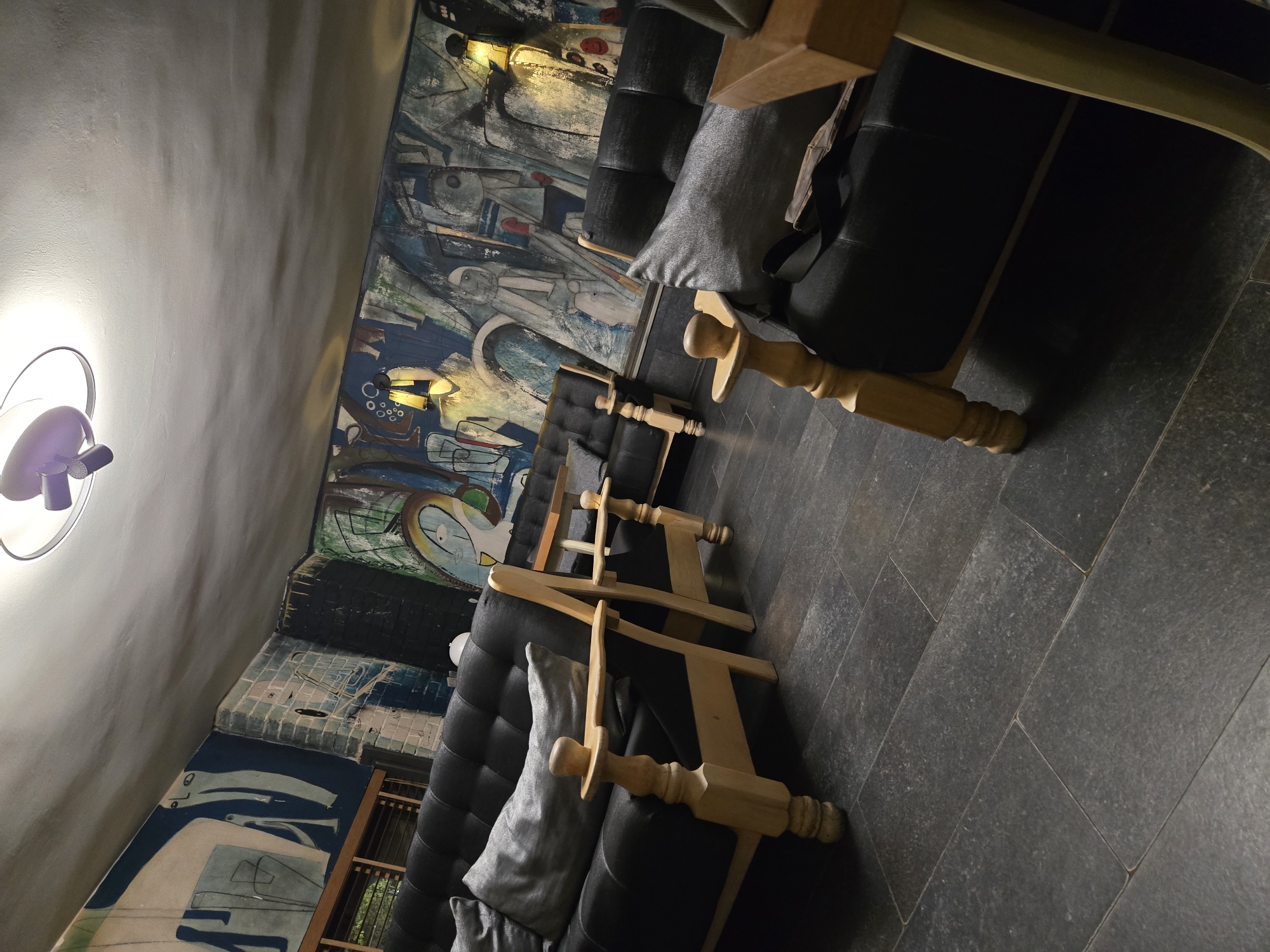 Indoor mural room and crescent moon documented same evening