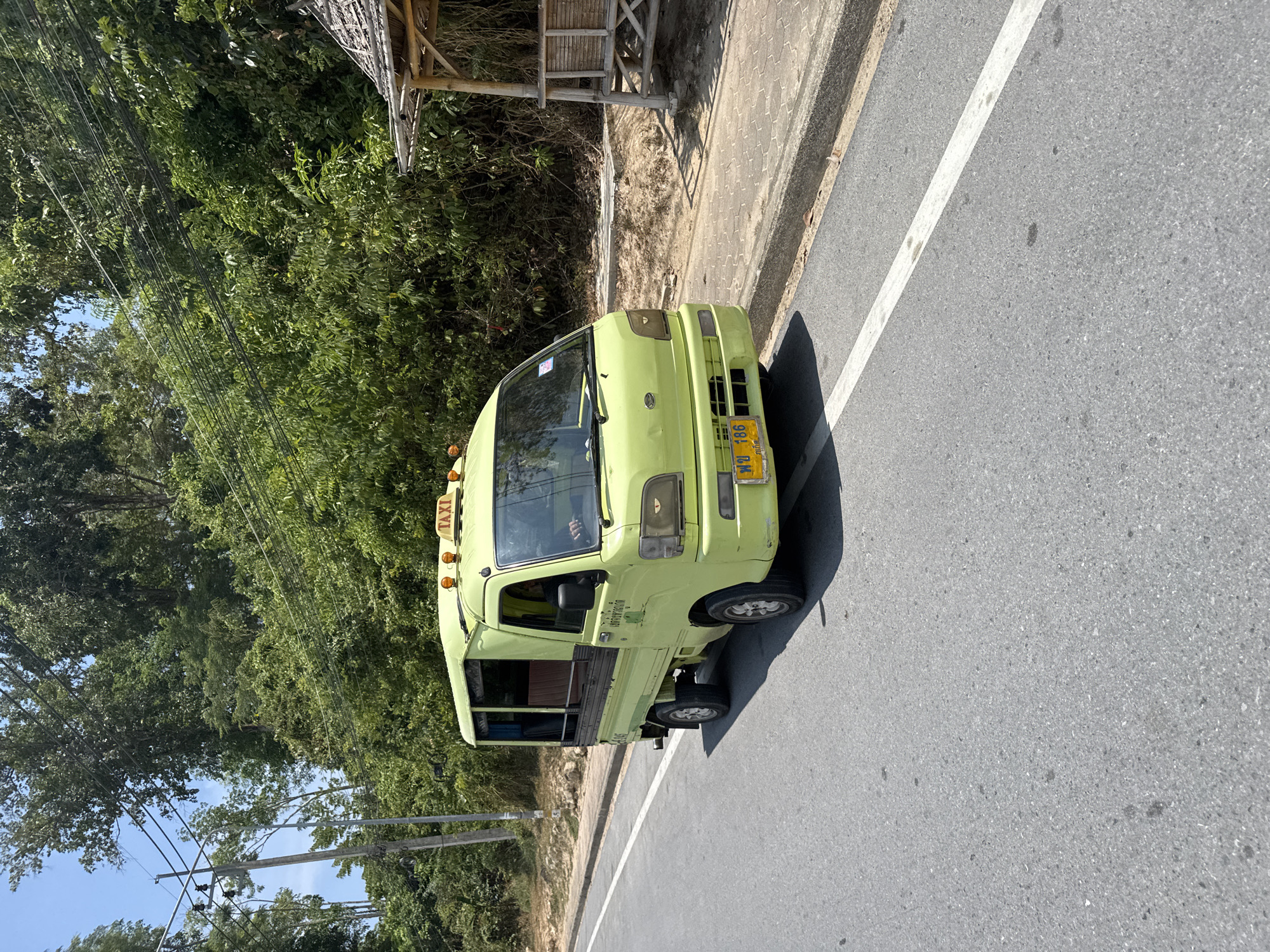Morning scenes captured in Patong: taxi-bus, convenience store