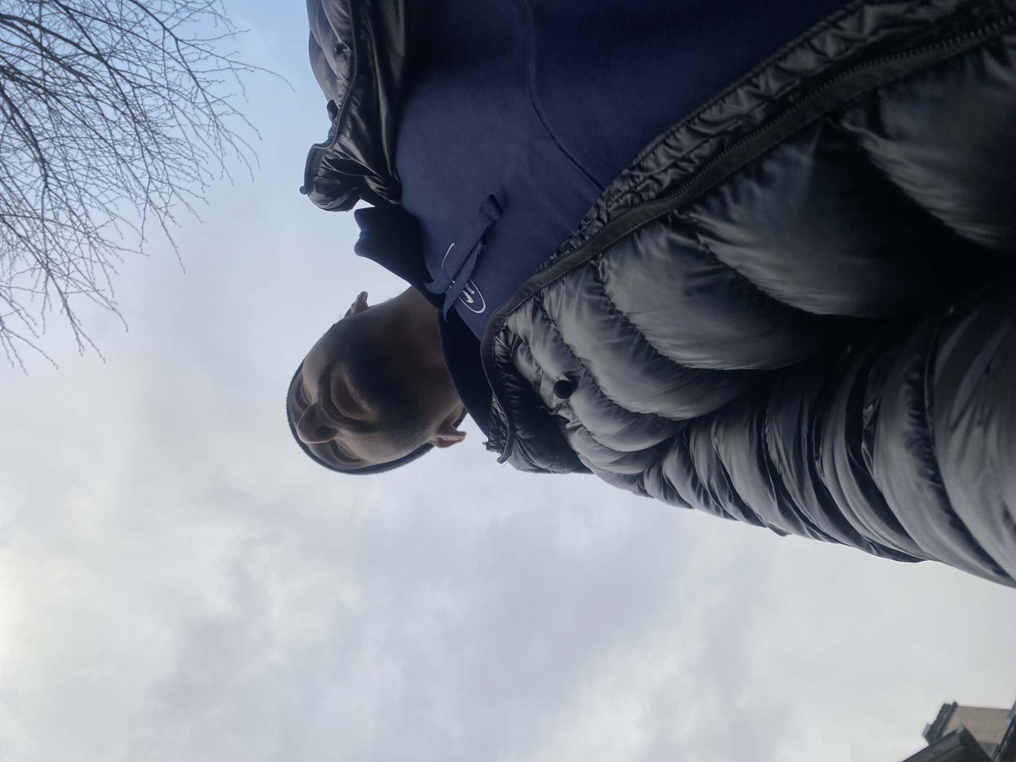 Man in winter clothing photographed from low angle