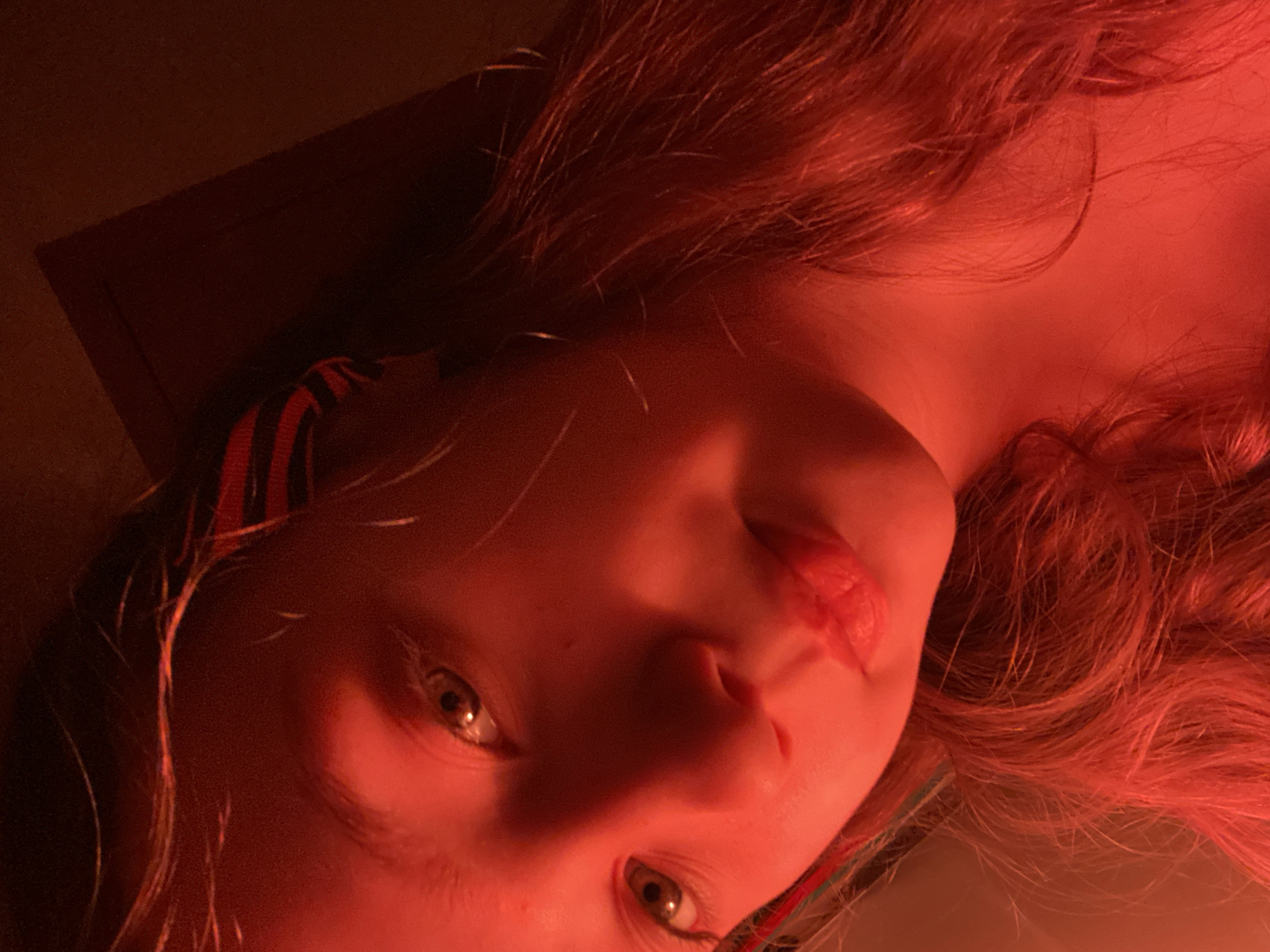 Young person photographed in various indoor poses and selfies