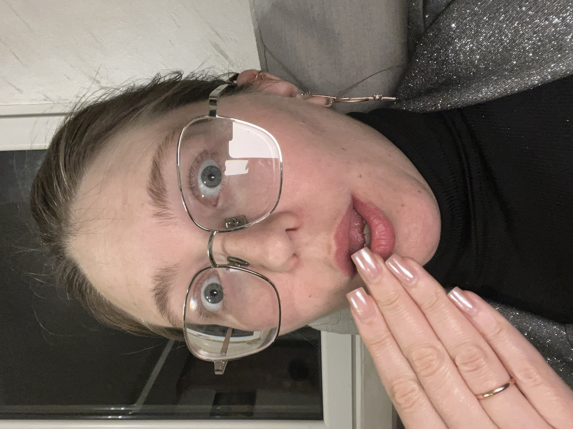 Woman takes playful indoor selfies in Podgorica apartment