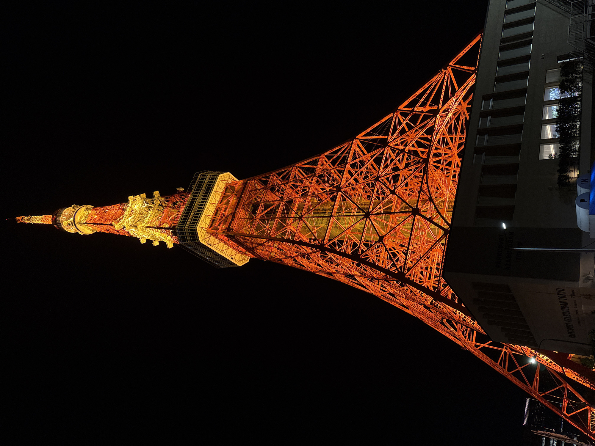 Tokyo Tower photographed at night in iconic orange illumination