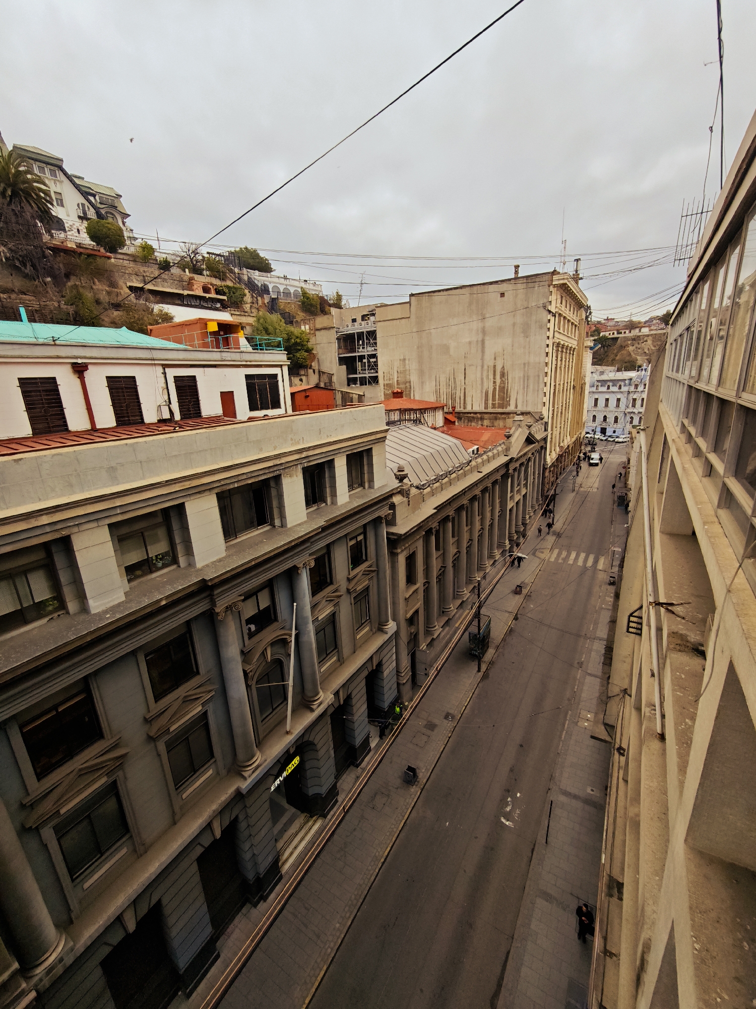 Street view captured in Valparaíso showing mixed architectural styles