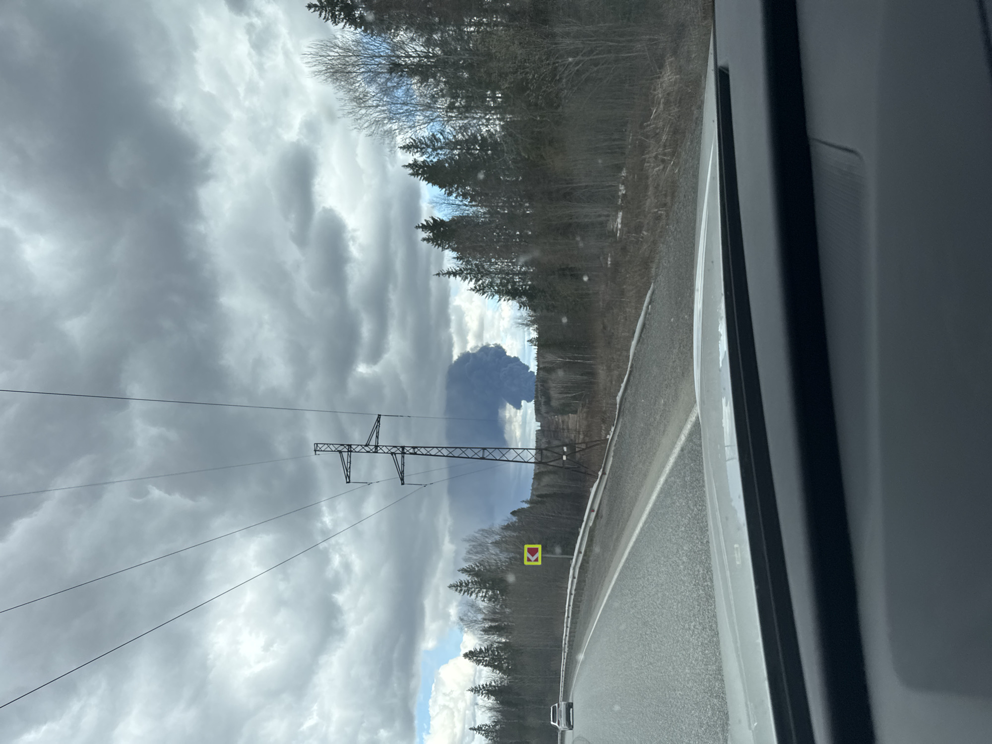Vehicle occupant documents cloudy road conditions in rural Russia
