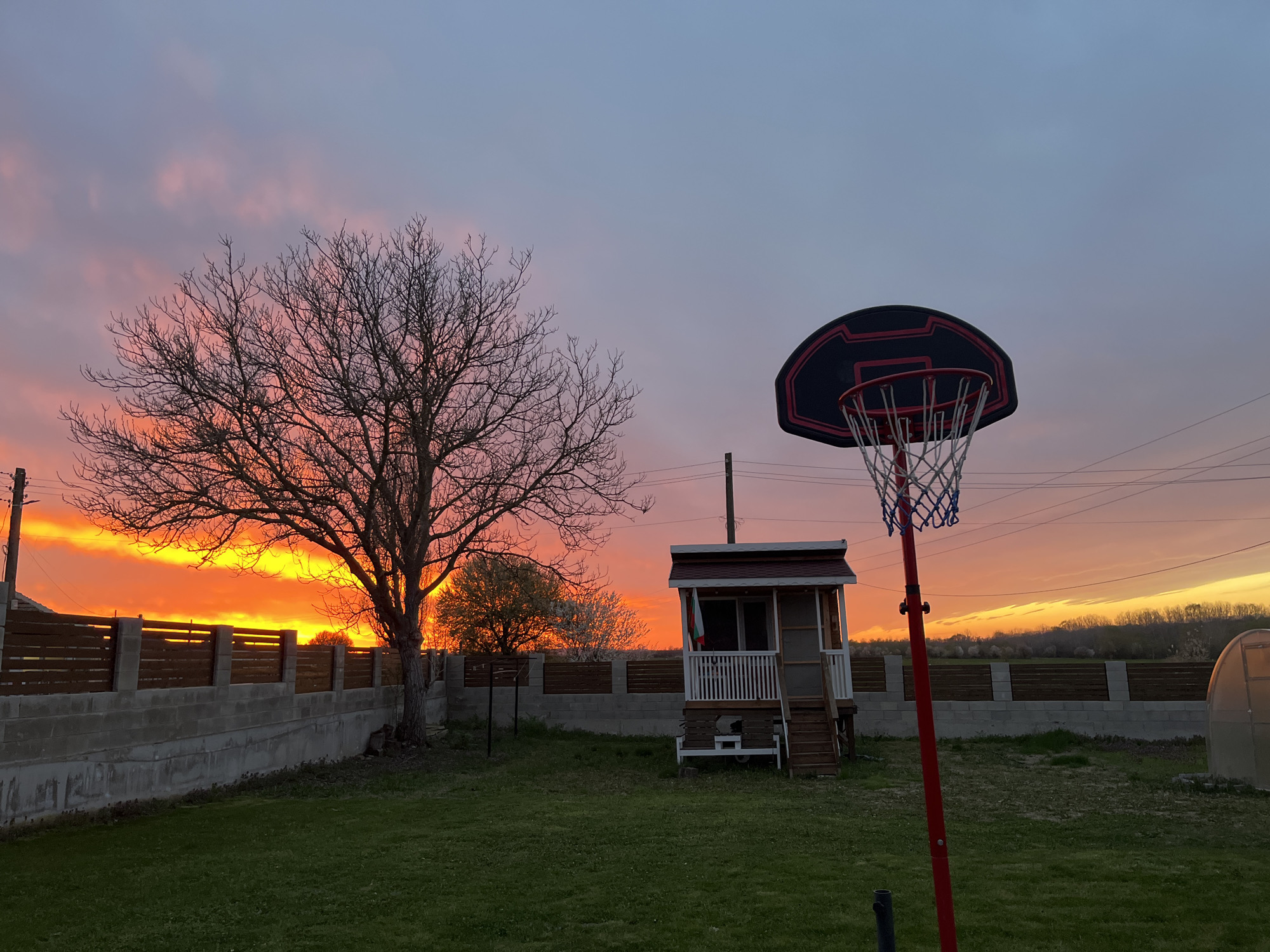 Sunset captured over residential backyard in Pchelnik, Bulgaria