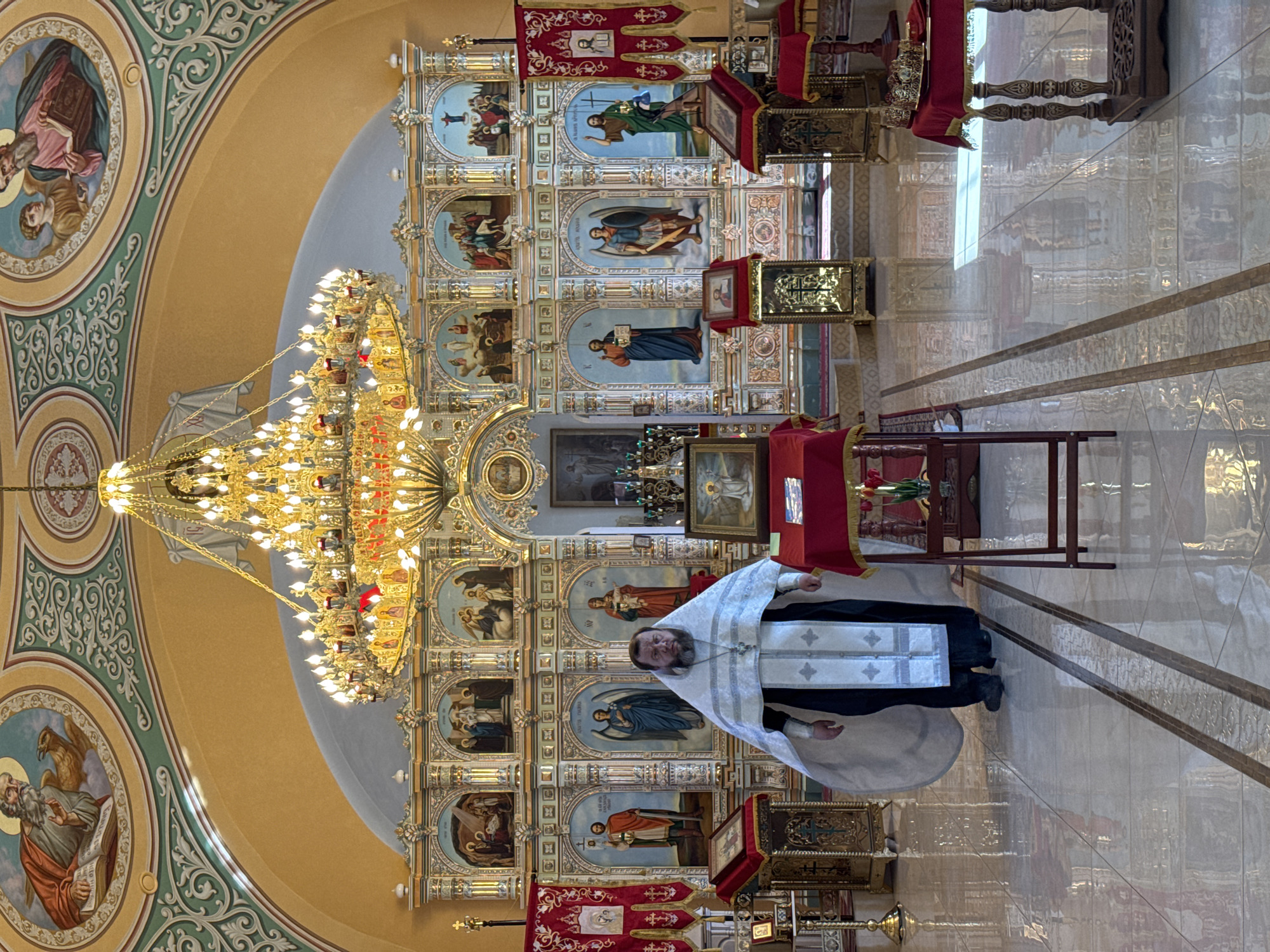 Orthodox wedding ceremony observed in ornate church setting
