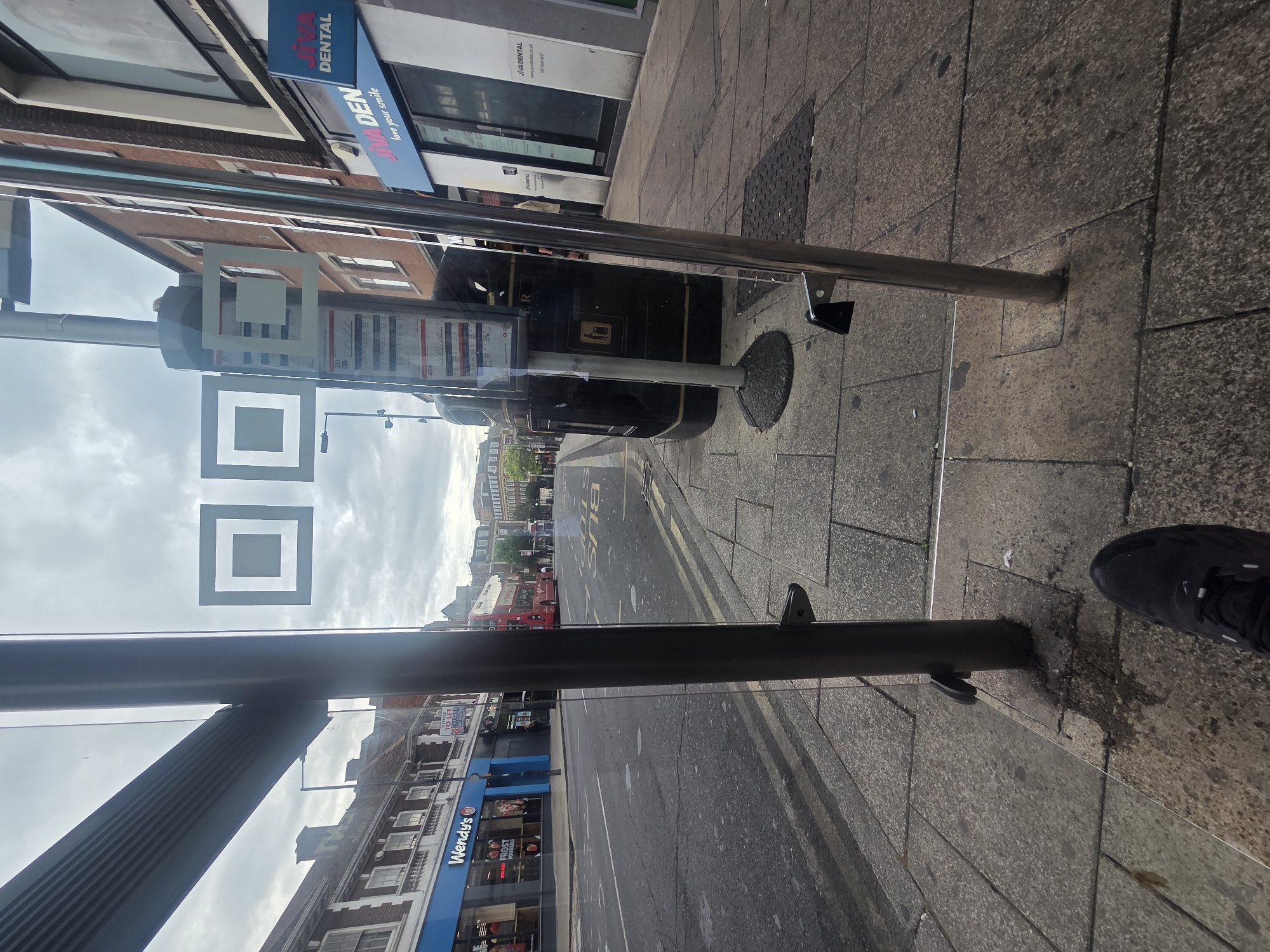 Early morning wait at a London bus shelter