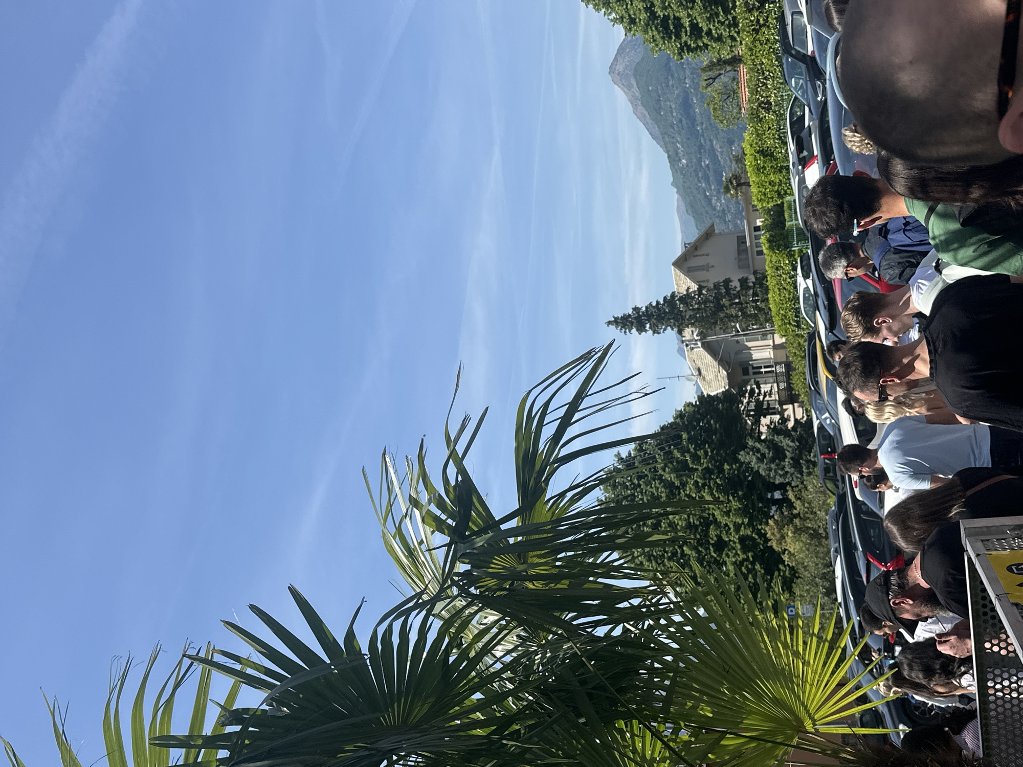 Crowded train platform draws passengers in sunny Gittana, Italy