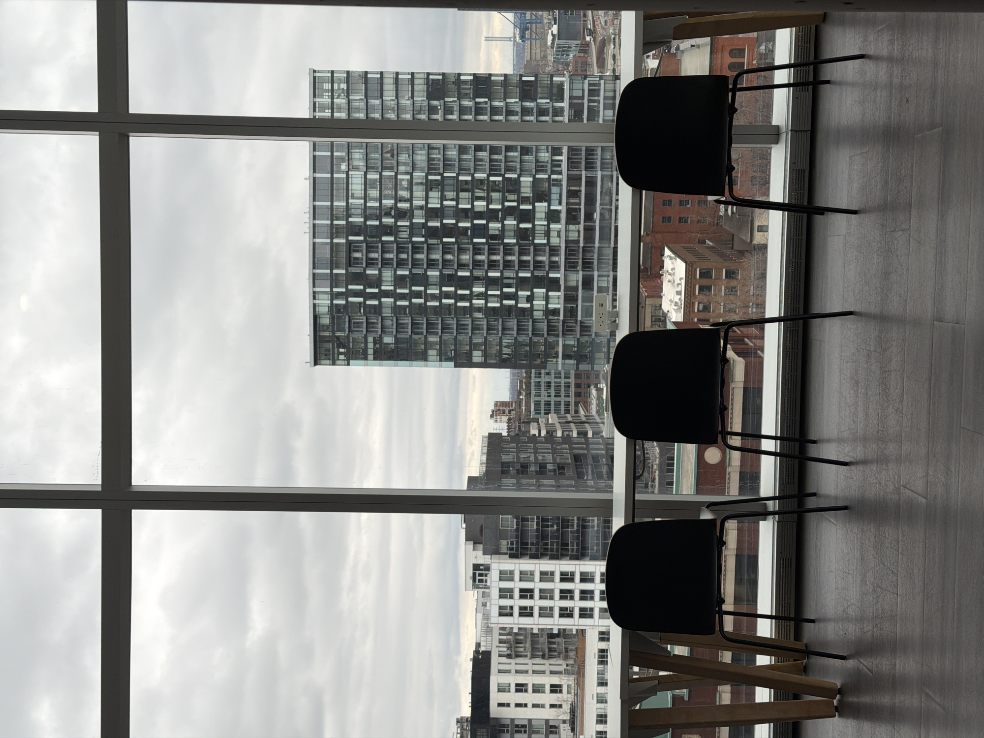Interior room view with Montreal architecture visible through window