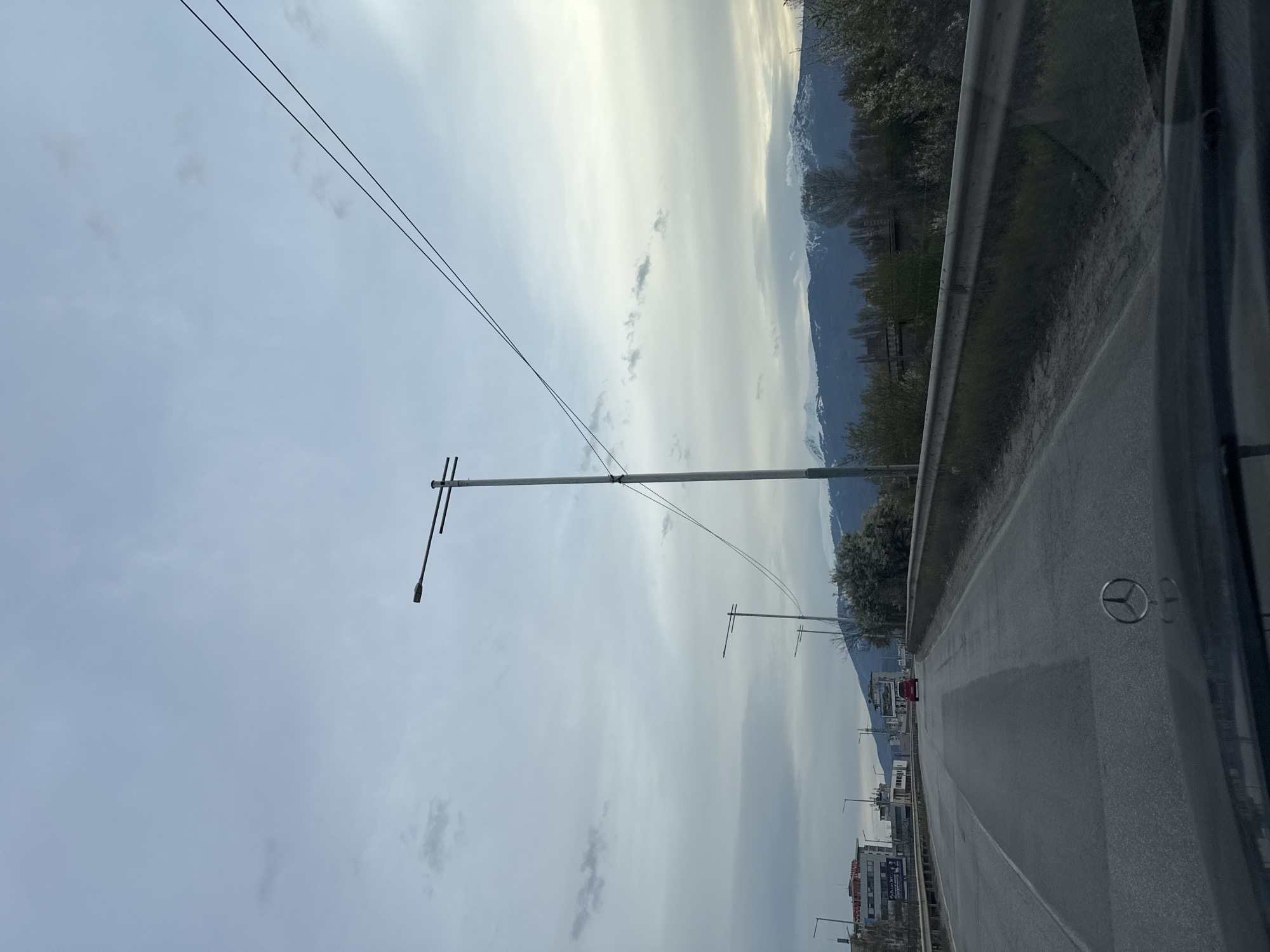 Vehicle travels paved road with guardrails outside Sofia