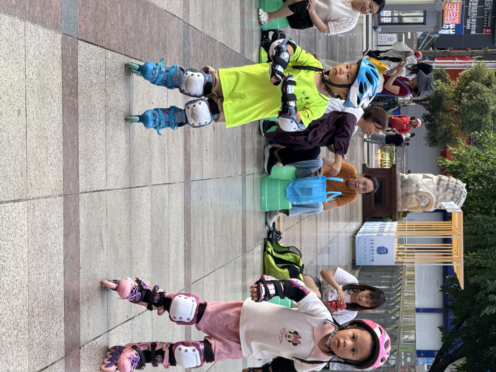 Children practice rollerblading in supervised outdoor session, Shapingba District