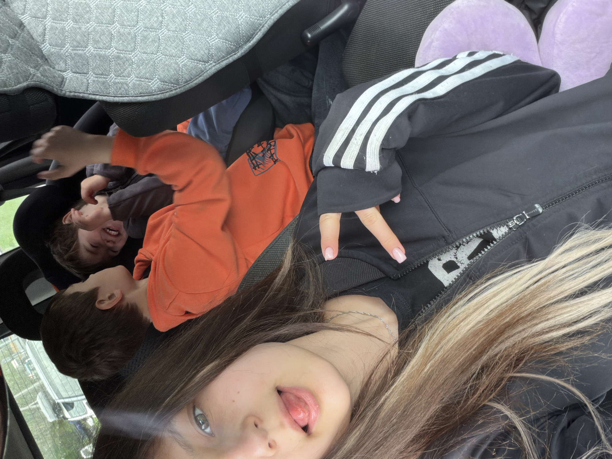 Woman takes selfie in car interior