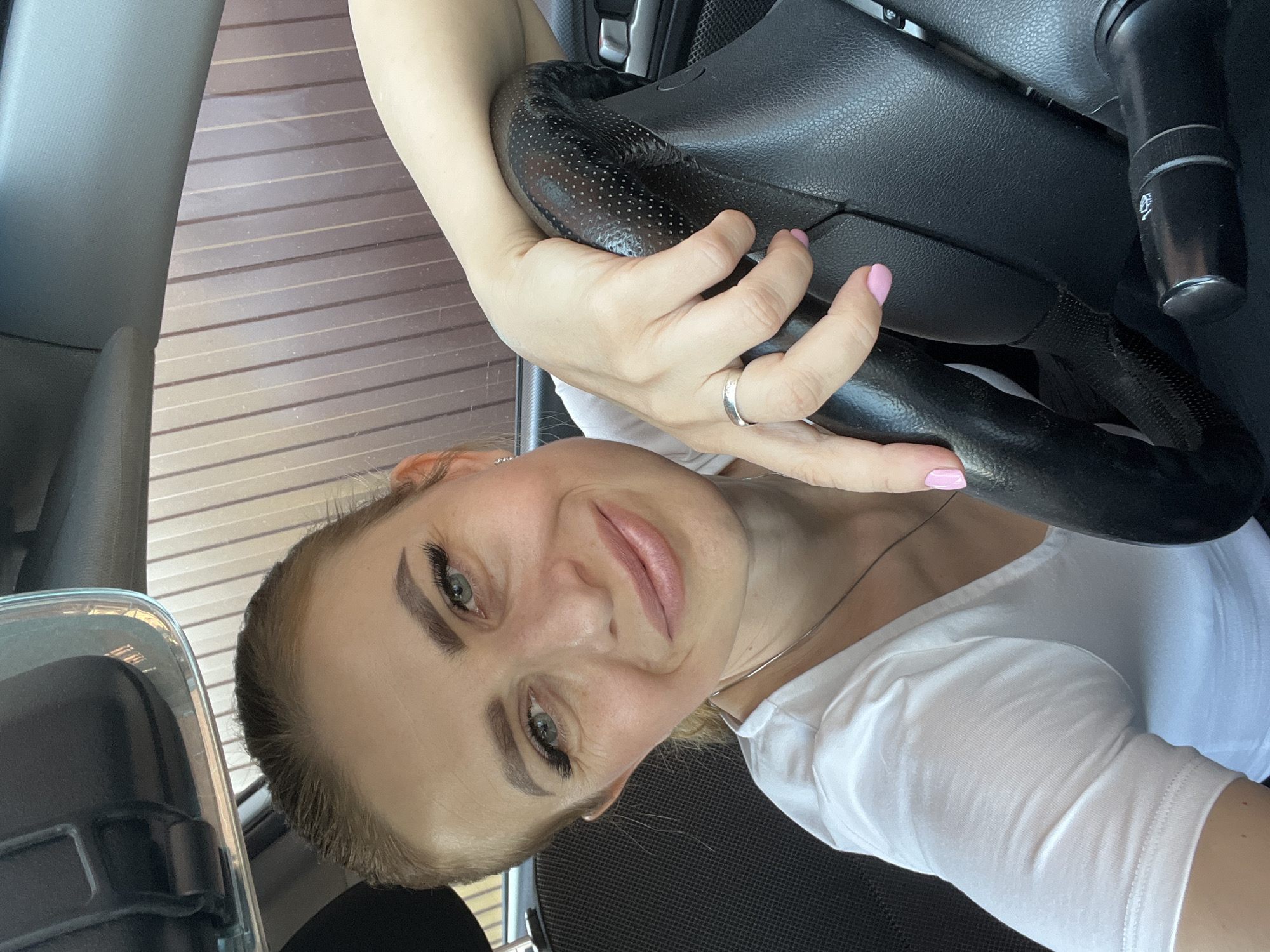 Selfie from a parked car near a residential fence in Bataysk