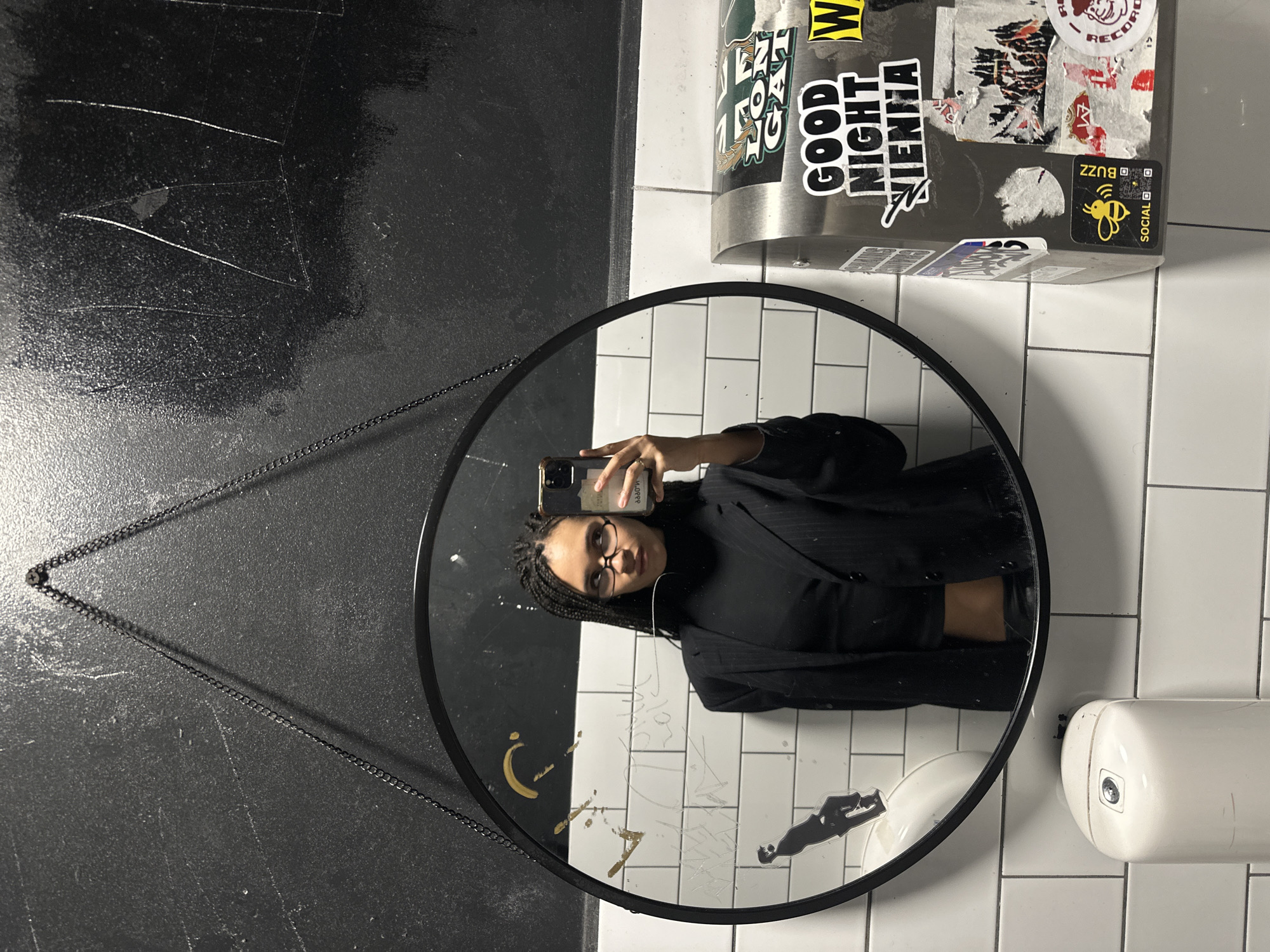 Mirror selfie taken in London public restroom facility