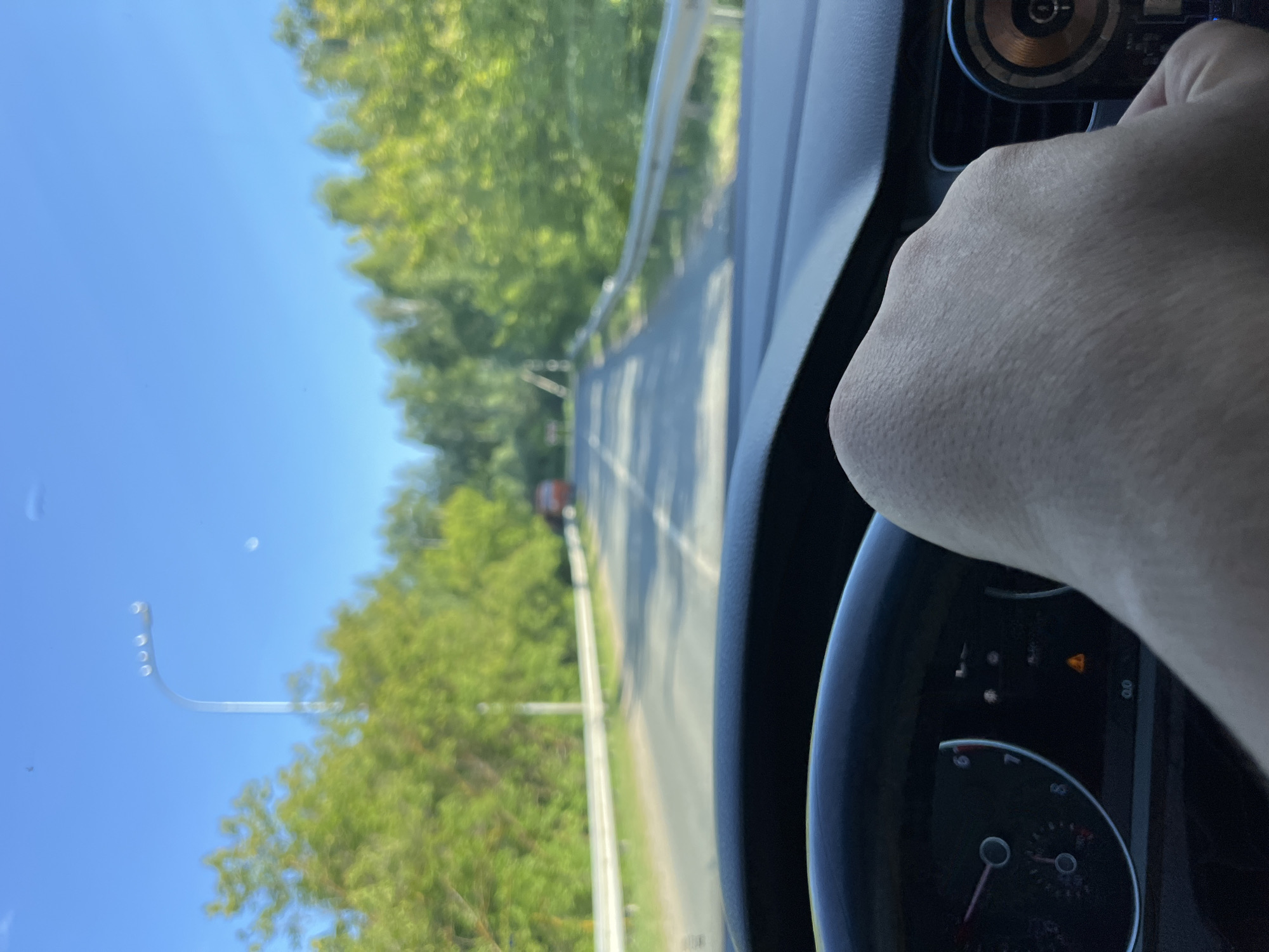 Car journey documented through Vasilyevo, Russia on wet roads