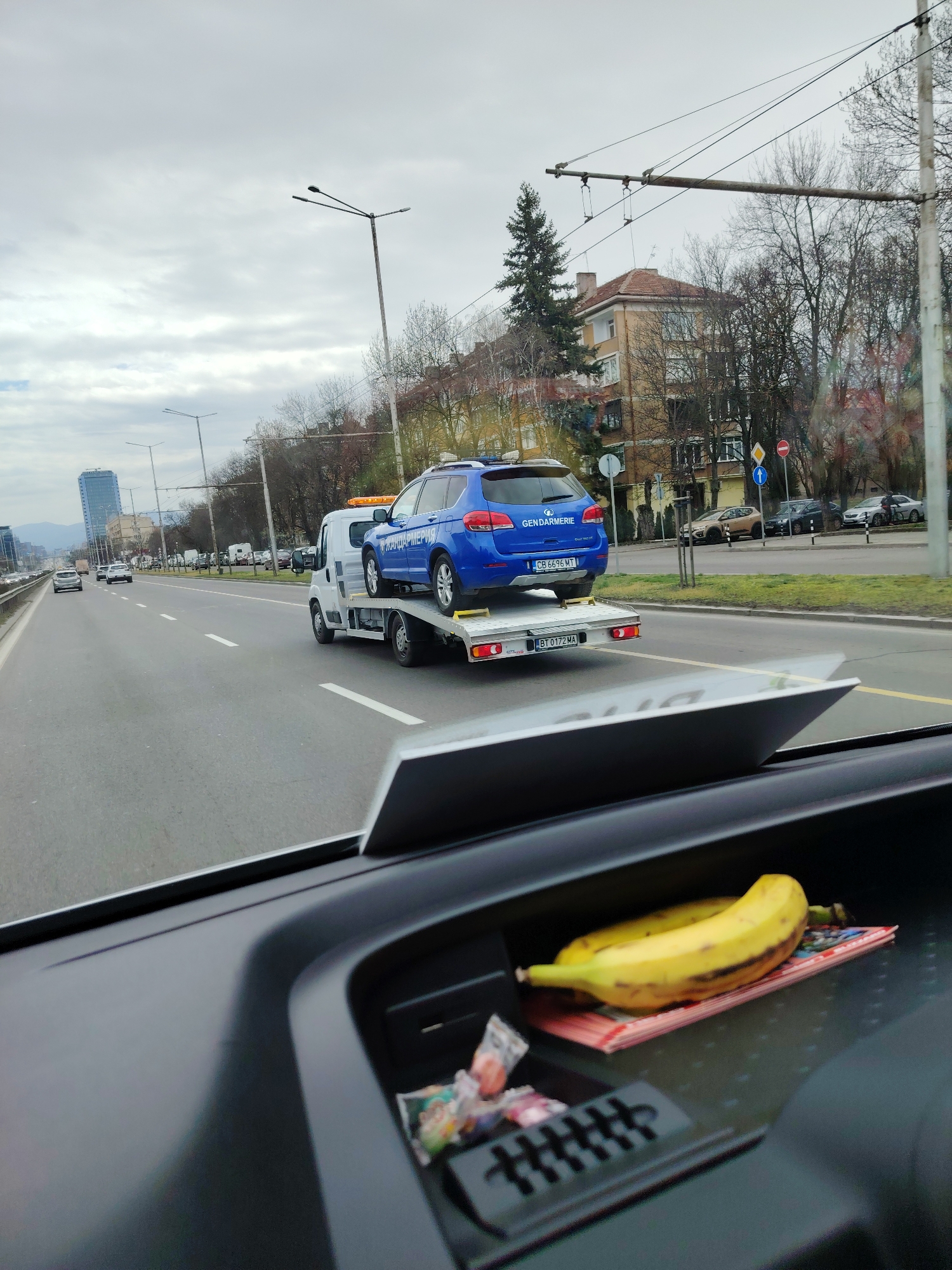 Tow truck transports police vehicle on Sofia road