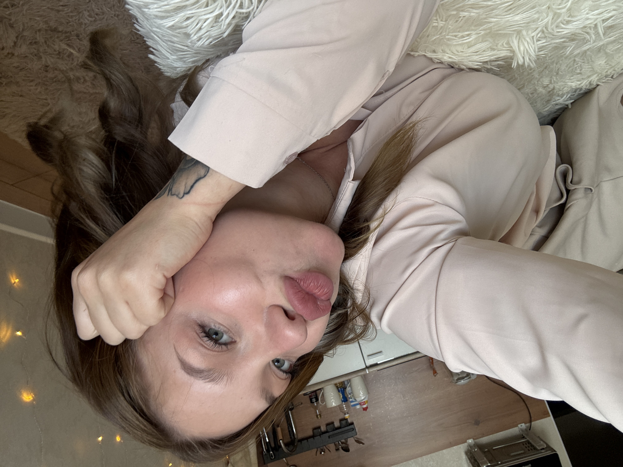 Selfies and a sleeping cat on a soft white rug