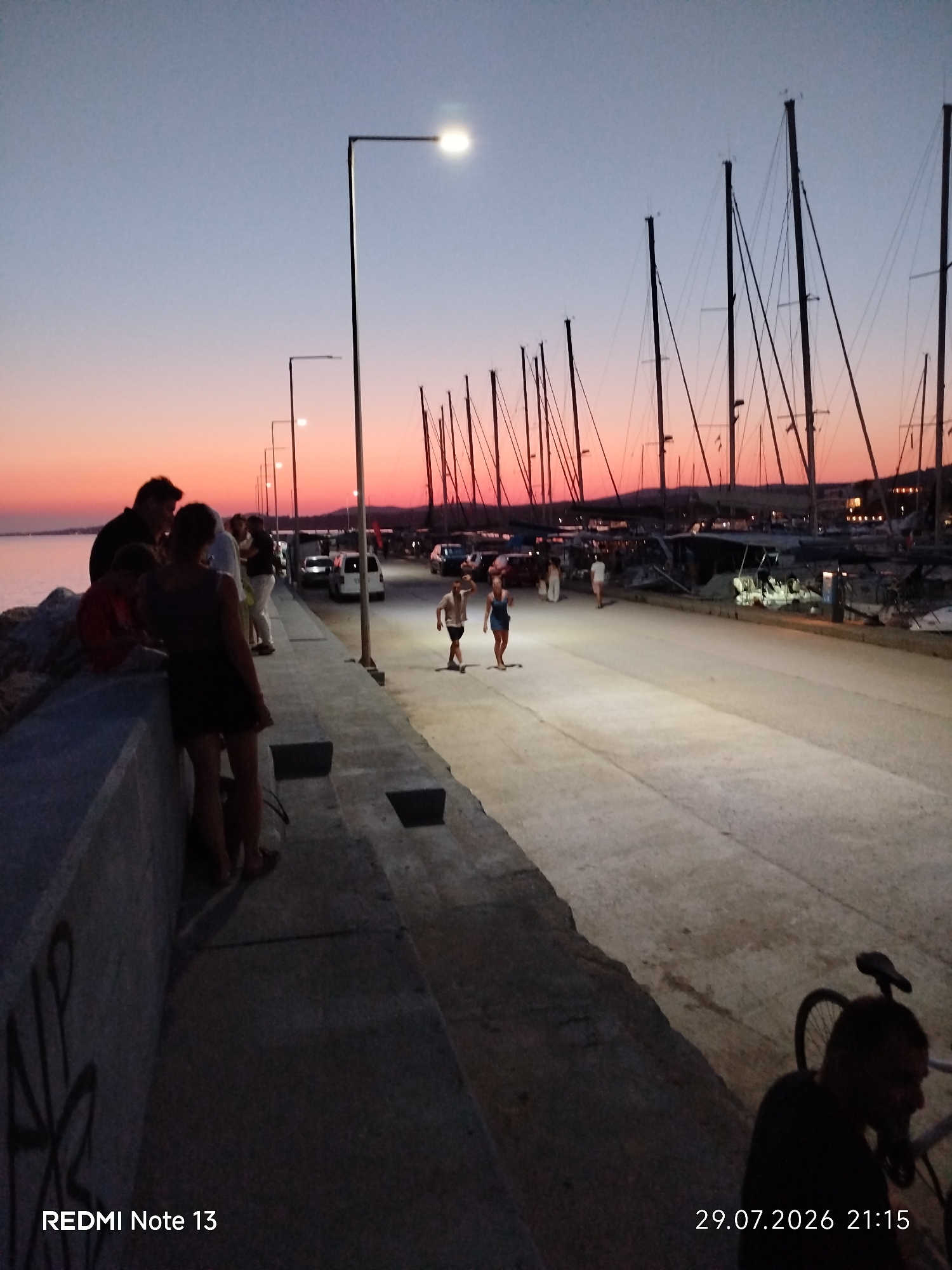 Sunset to moonrise at a Sithonia harbor promenade