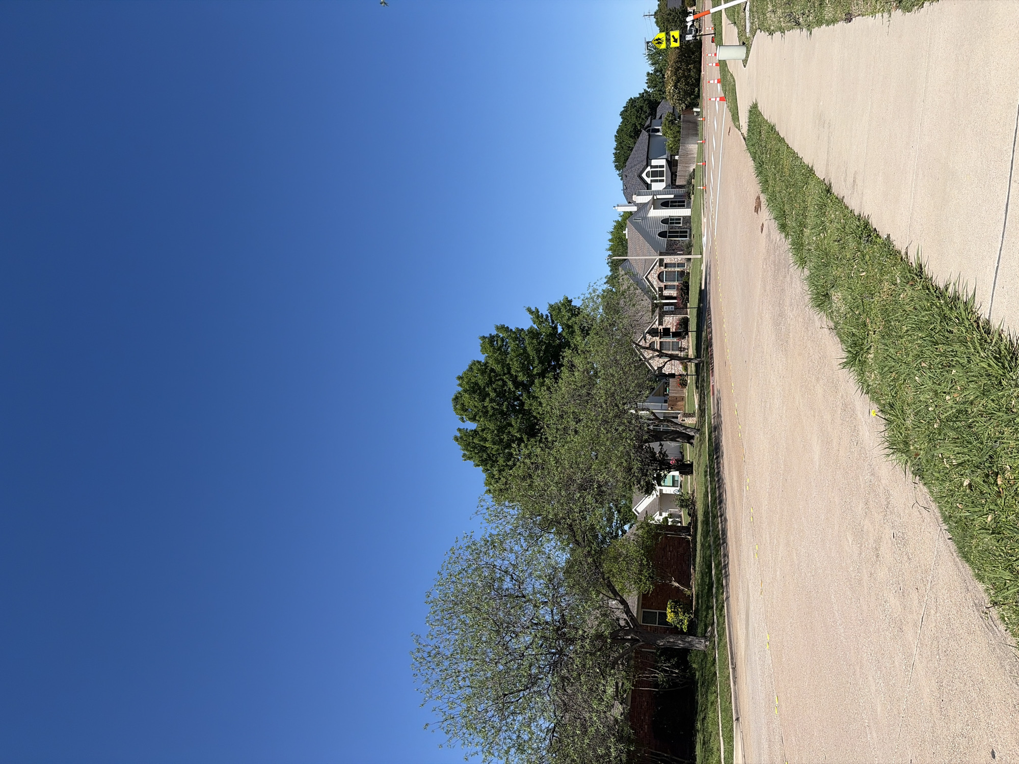 Pedestrian walks residential street in Trophy Club, Texas