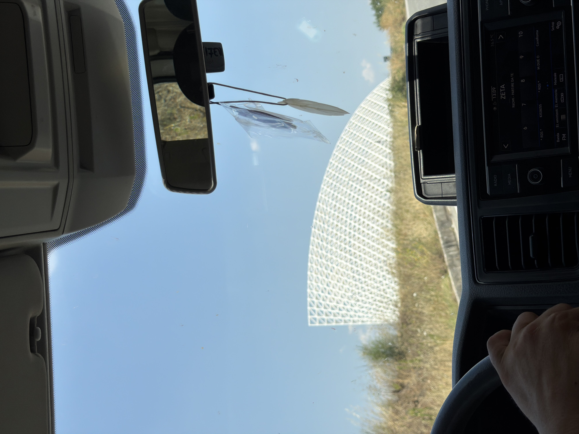 Road trip passing through a large outdoor event site