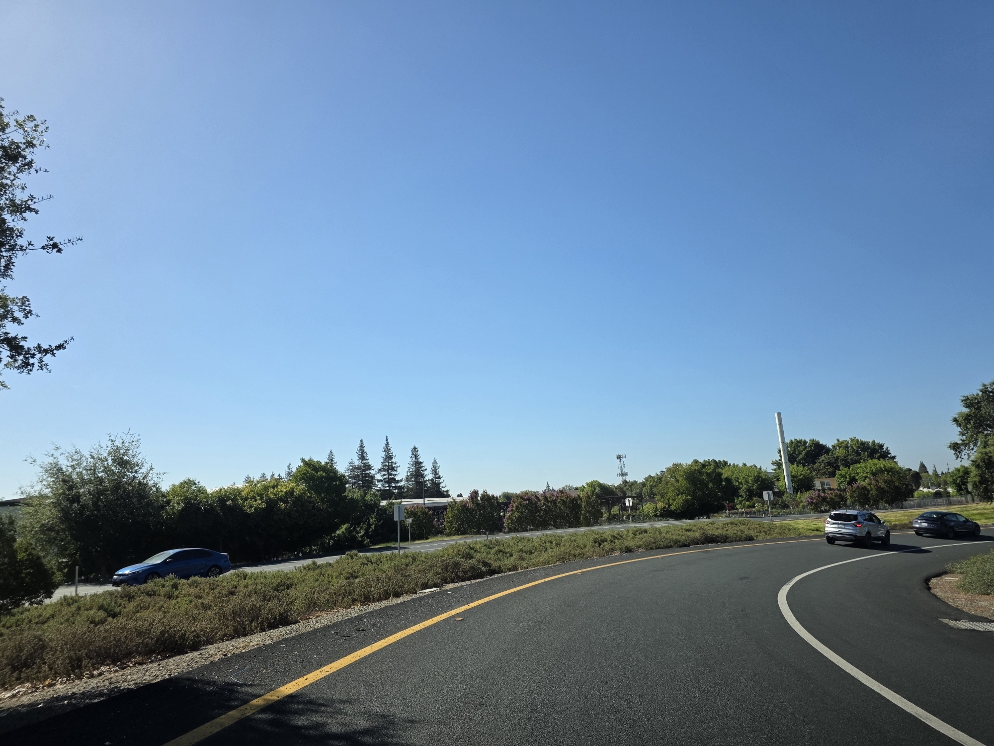 Sunny afternoon traffic on a multi-lane Elk Grove highway