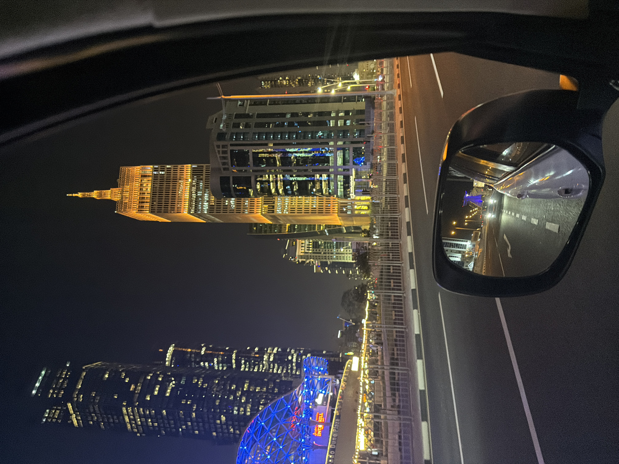 Doha skyscrapers display colorful light shows during evening hours