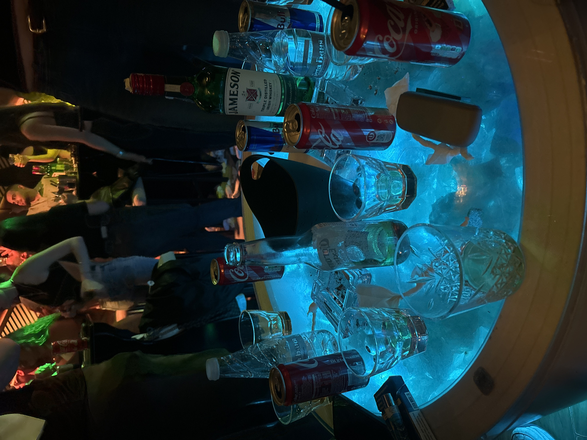 Neon-lit drinking table documented in Veliko Tarnovo nightlife scene