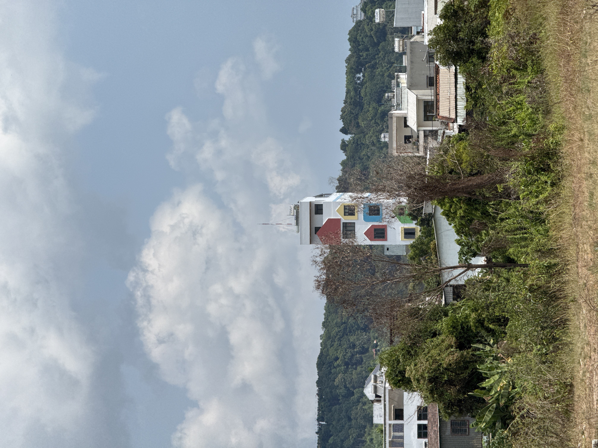 Colorful-windowed white building observed in Phú Quốc, Vietnam
