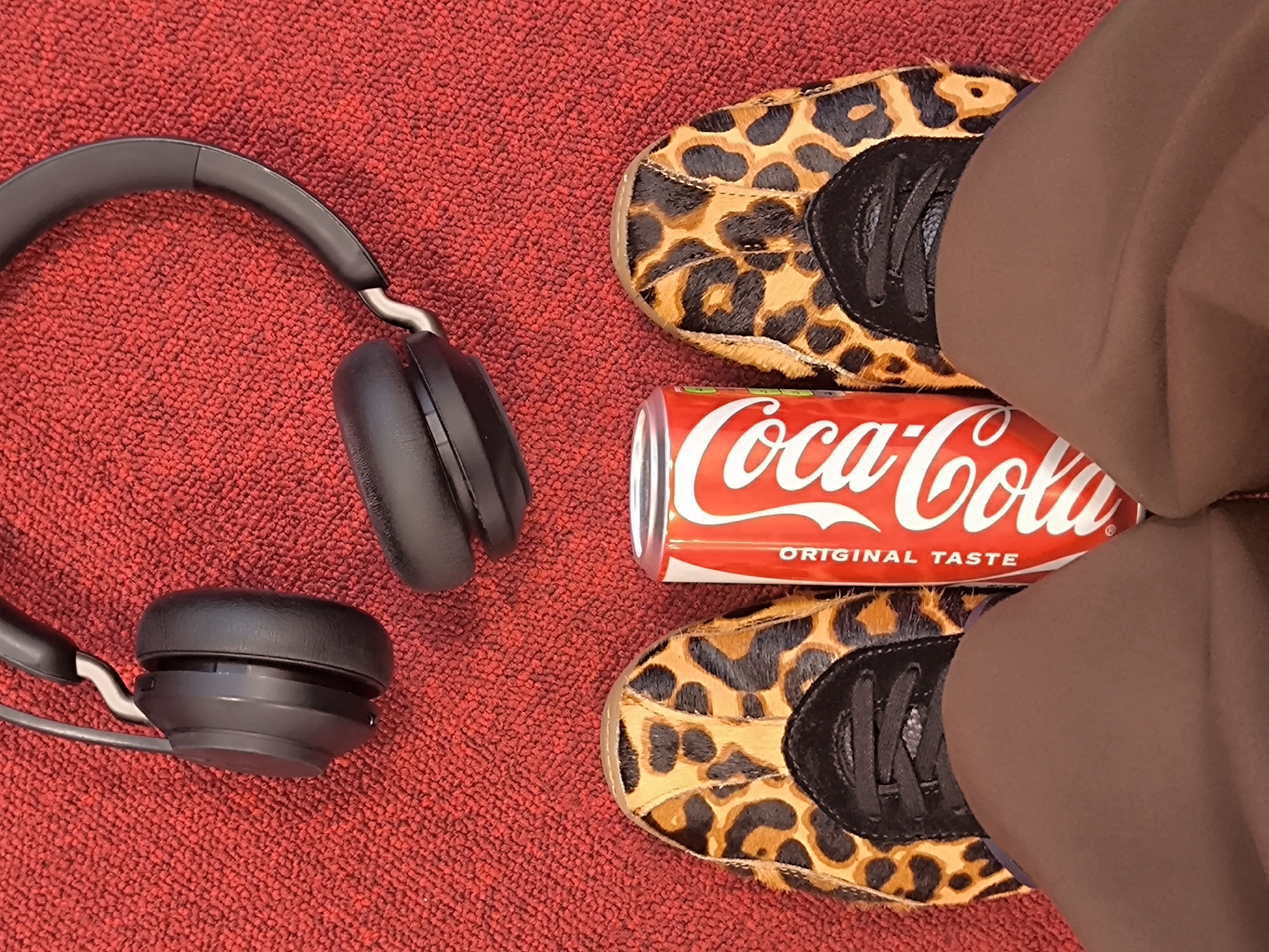 Riga resident documents casual desk snack moment with headphones